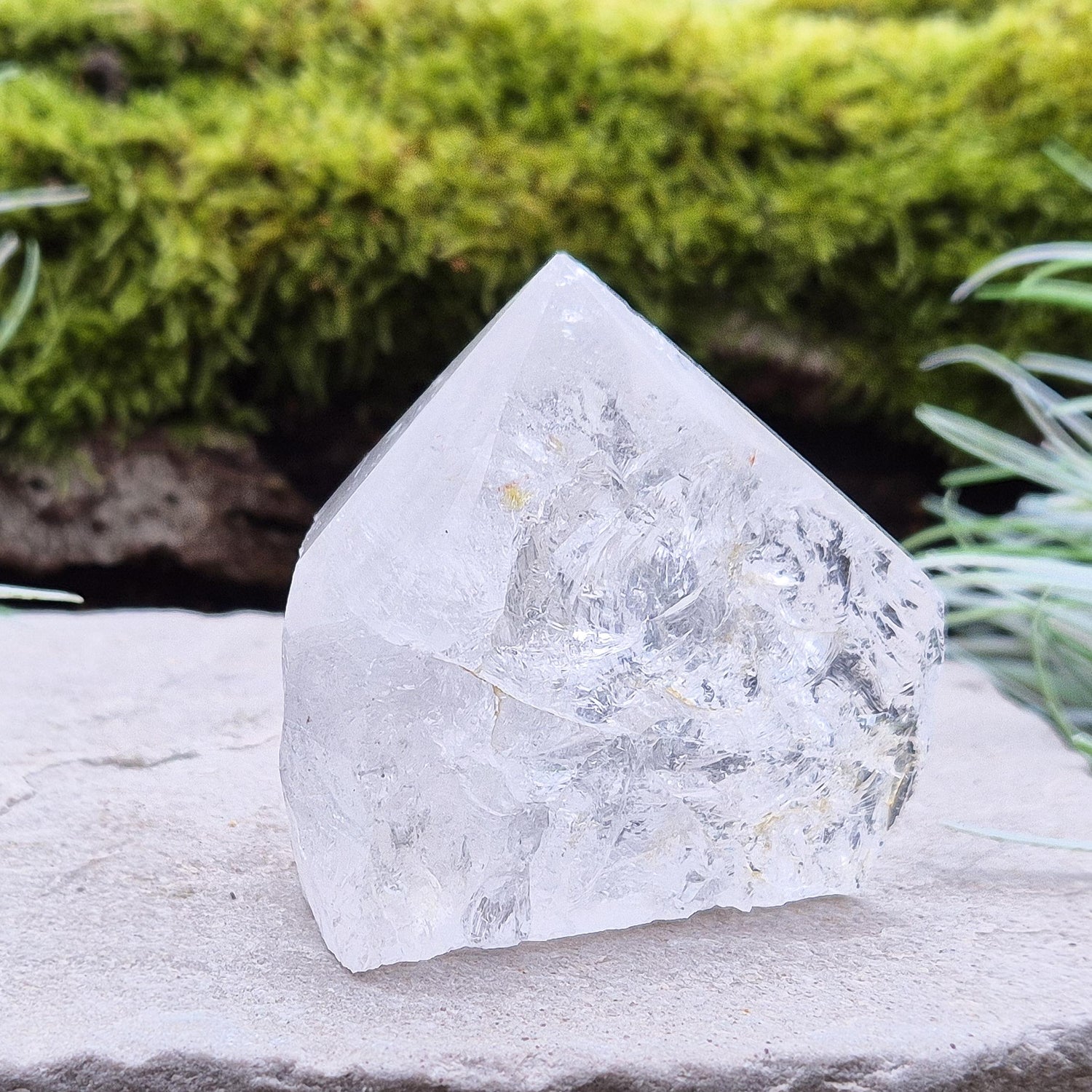 Quartz Crystal Standing Point, from Brazil. Point is polished at tip, sides are natural and the base is cut flat so it will sit on an even surface. Lovely clarity and light refraction within it.