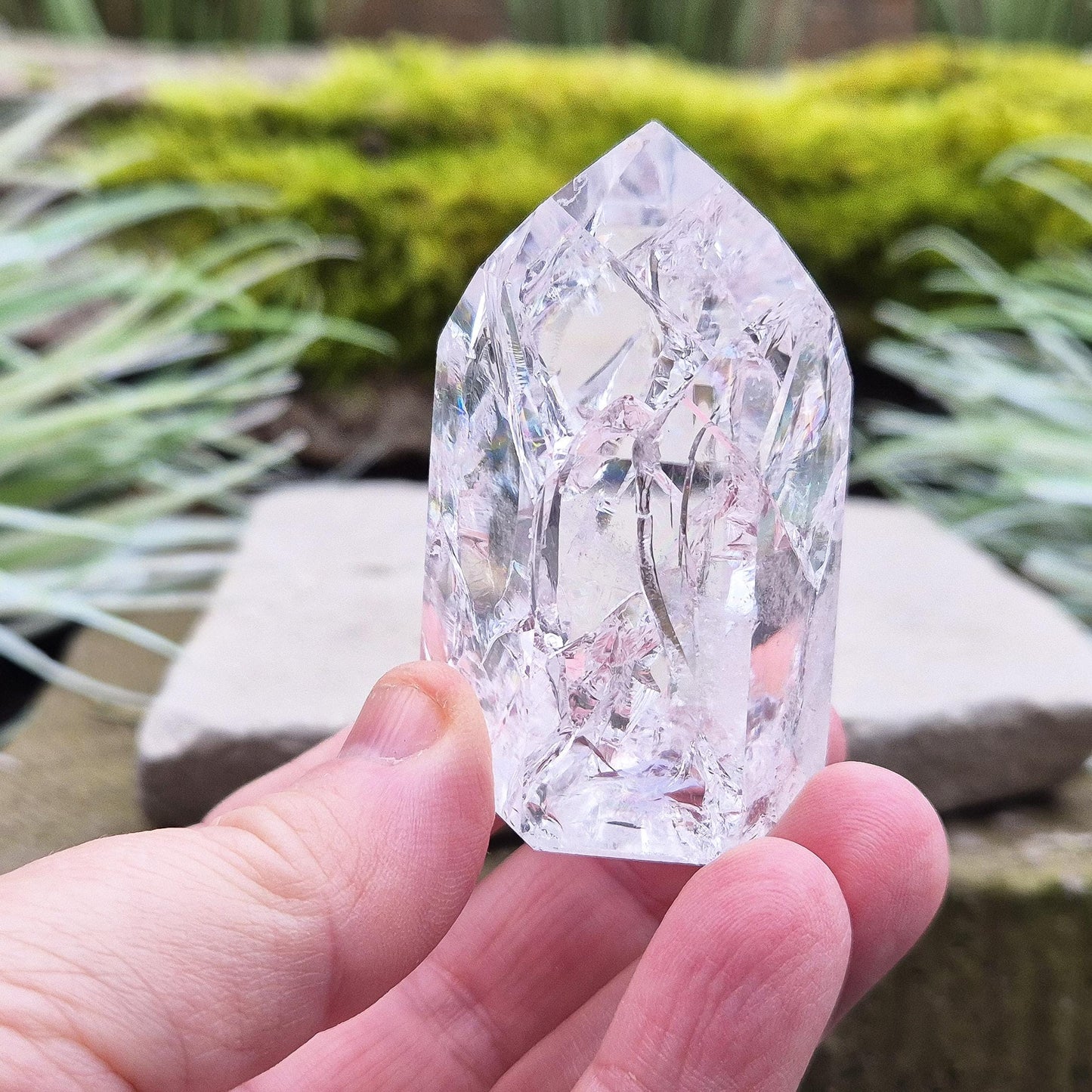 Fire and Ice Quartz Polished Standing Point (also known as Rainbow Quartz) is created by heating and rapidly cooling quartz. 