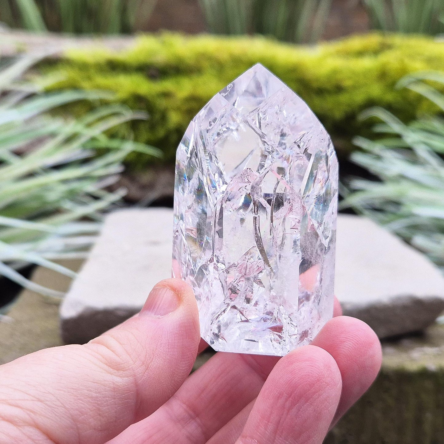 Fire and Ice Quartz Polished Standing Point (also known as Rainbow Quartz) is created by heating and rapidly cooling quartz. 