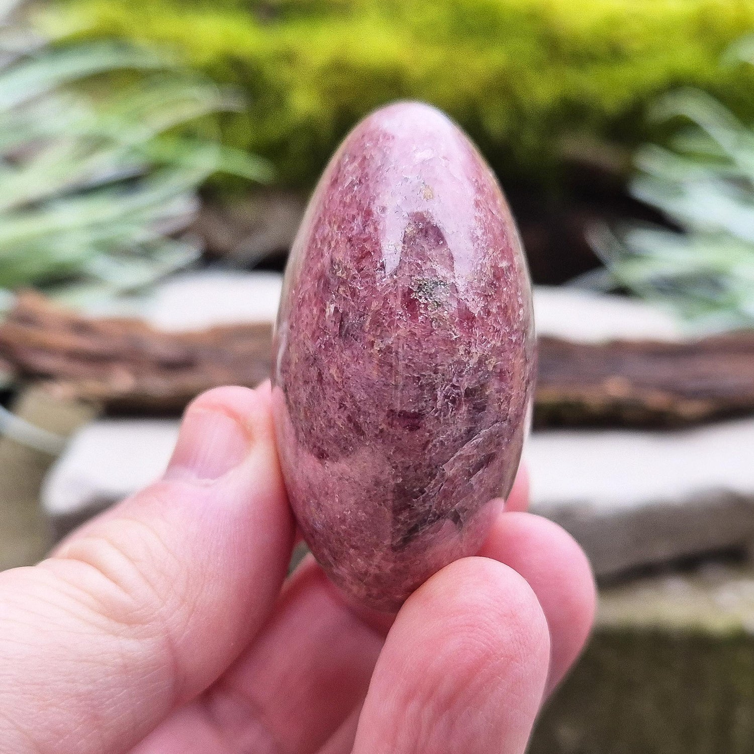 Rhodonite Crystal Pebble, Zimbabwe. Lovely Pink colouring with some black patches caused by the oxidation of Manganese. Lovely shimmer on the surface.