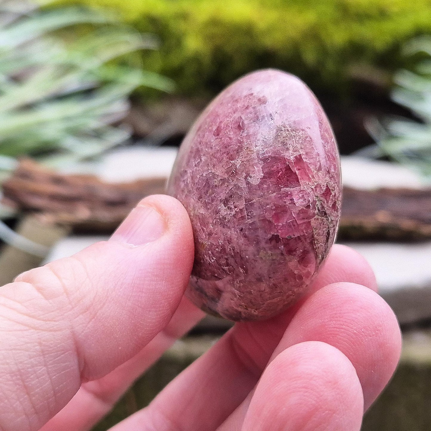 Rhodonite Crystal Pebble, Zimbabwe. Lovely Pink colouring with some black patches caused by the oxidation of Manganese. Lovely shimmer on the surface.