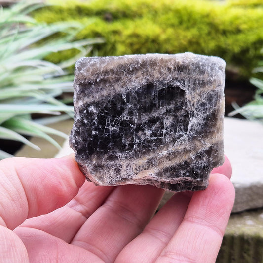 Black Moonstone from Madagascar, natural piece. Black Moonstone is a variety of moonstone that features dark shades, often with a subtle shimmer. 