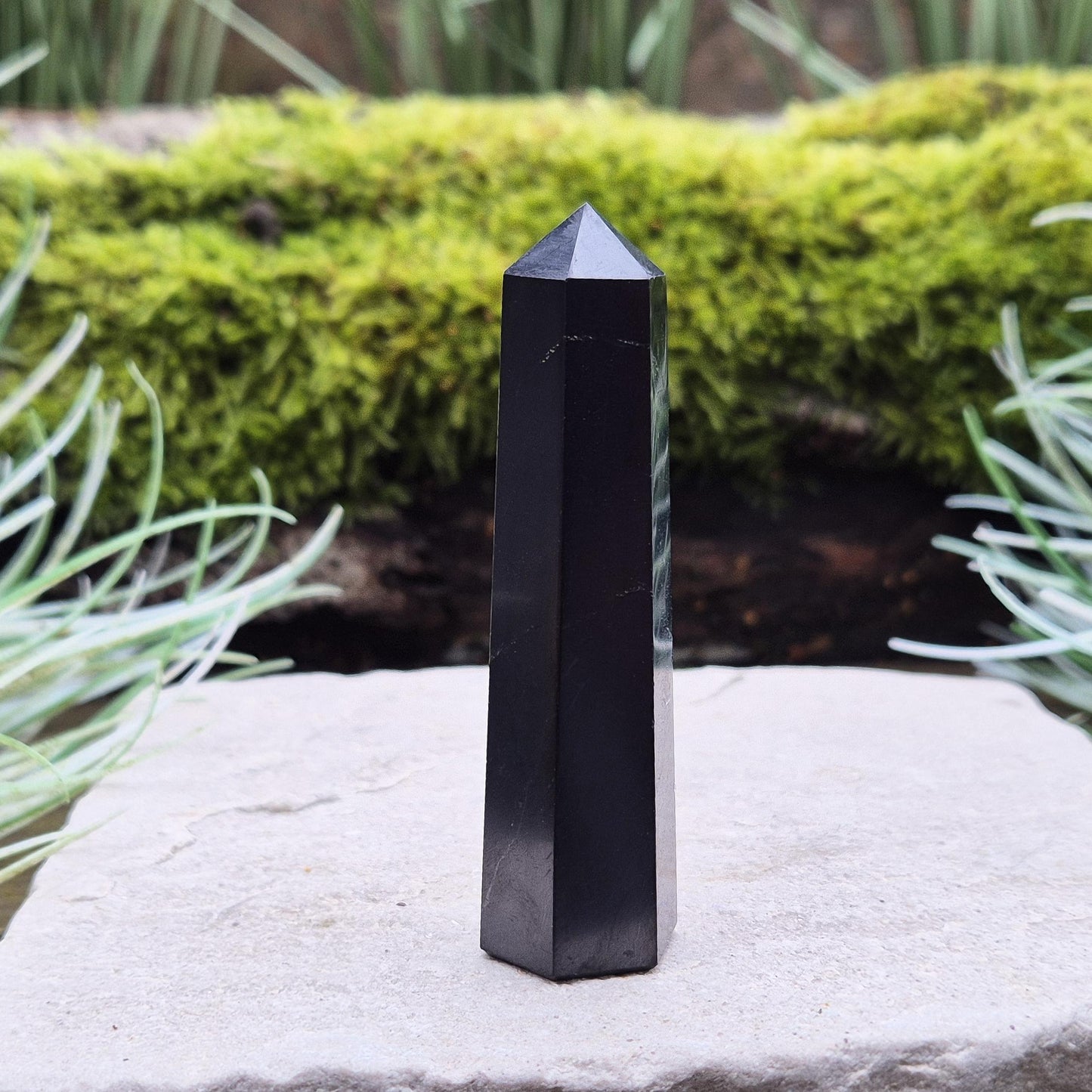 Shungite Point or Tower from the Karelia region of Russia, polished to a smooth finish. Has a 6 sided generator tip.