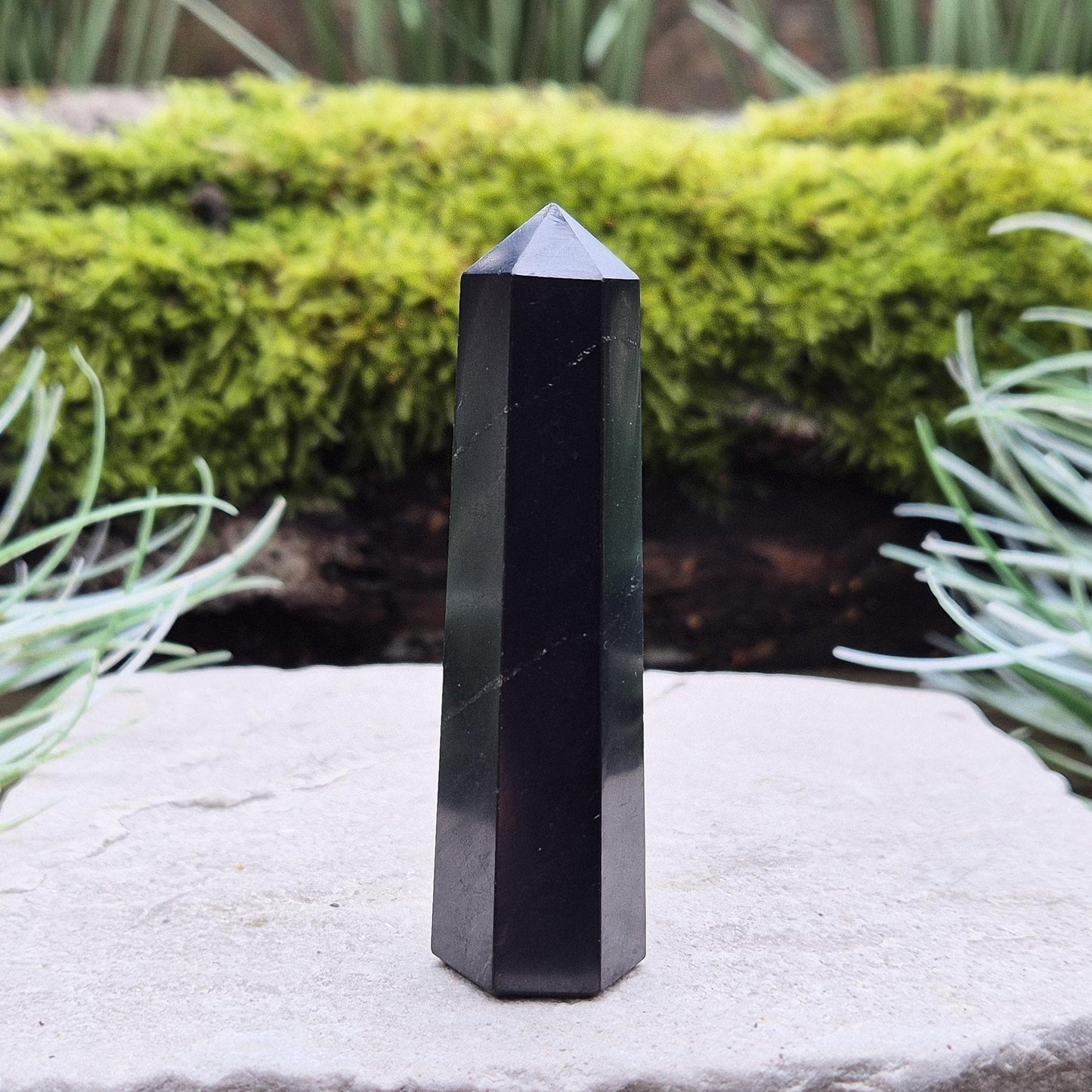 Shungite Point or Tower from the Karelia region of Russia, polished to a smooth finish. Has a 6 sided generator tip.