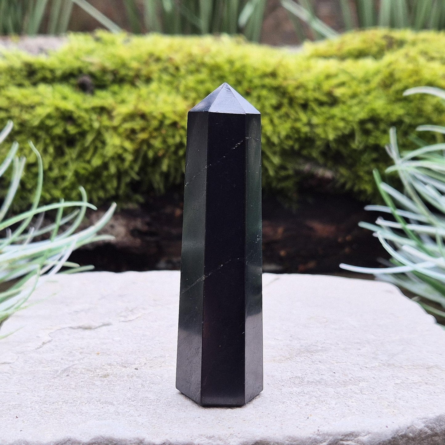 Discover the power of Shungite! This polished point helps create a peaceful environment, perfect for crystal lovers seeking balance and energy protection.