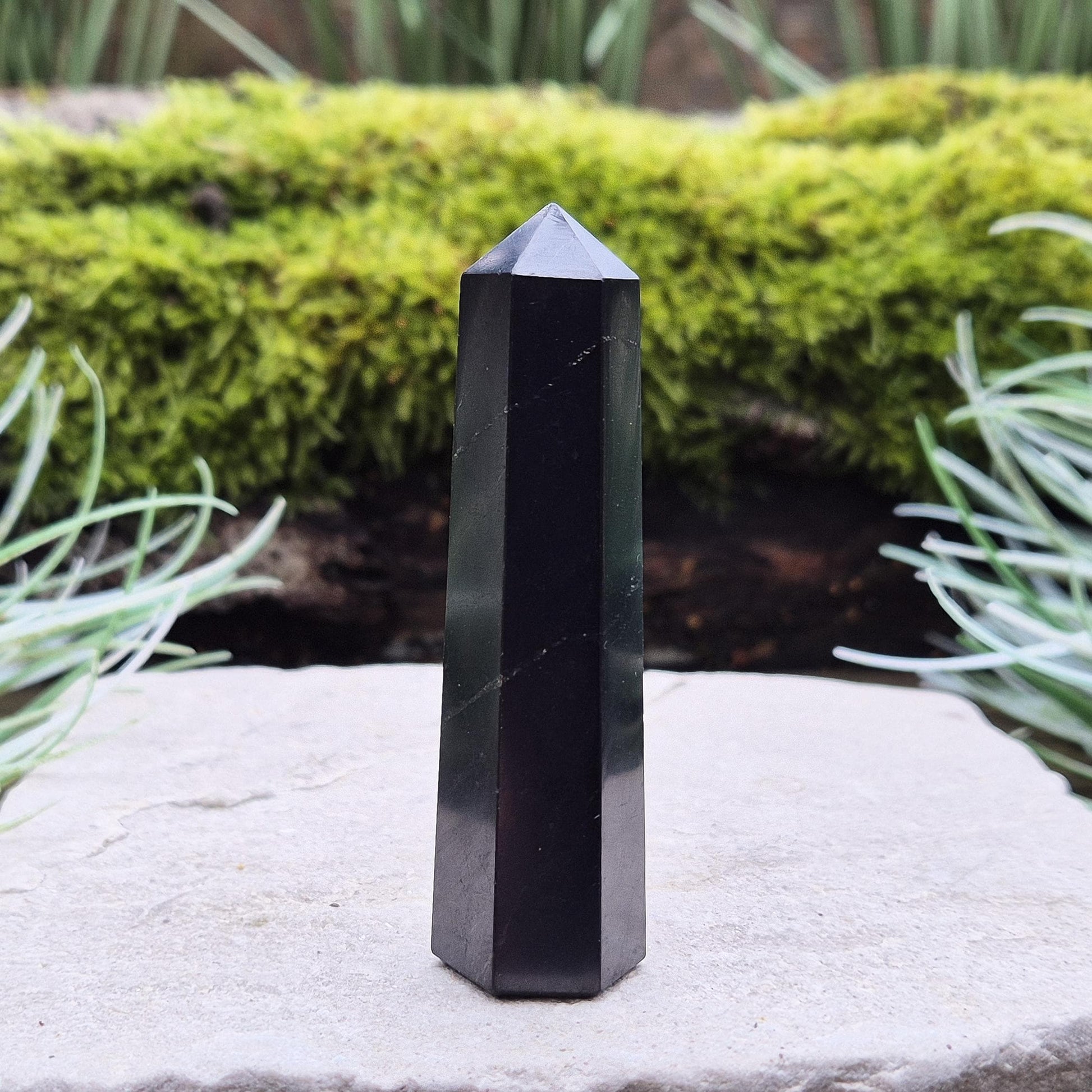 Discover the power of Shungite! This polished point helps create a peaceful environment, perfect for crystal lovers seeking balance and energy protection.