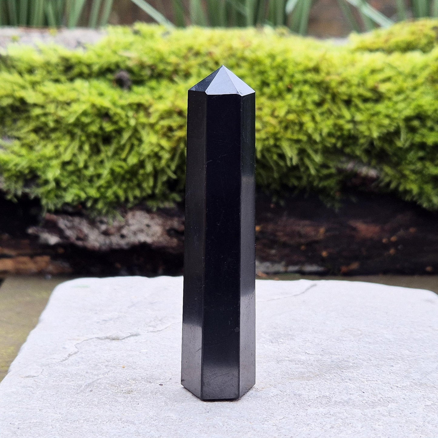 Shungite Point or Tower from the Karelia region of Russia, polished to a smooth finish. Has a 6 sided generator tip.