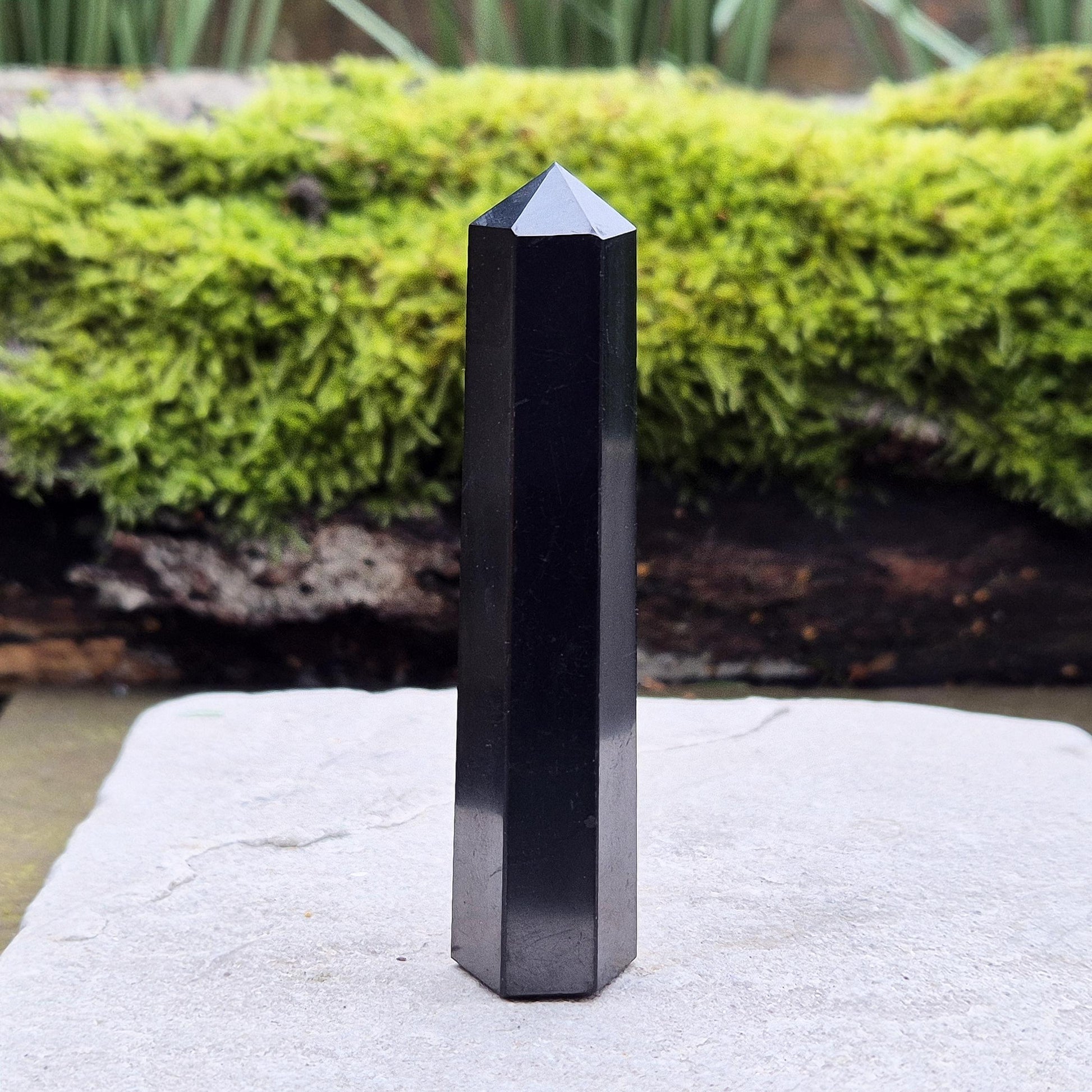 Discover the power of Shungite! This polished point helps create a peaceful environment, perfect for crystal lovers seeking balance and energy protection.