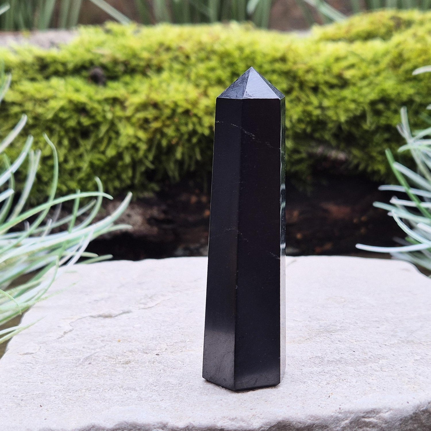 Shungite Point or Tower from the Karelia region of Russia, polished to a smooth finish. Has a 6 sided generator tip.