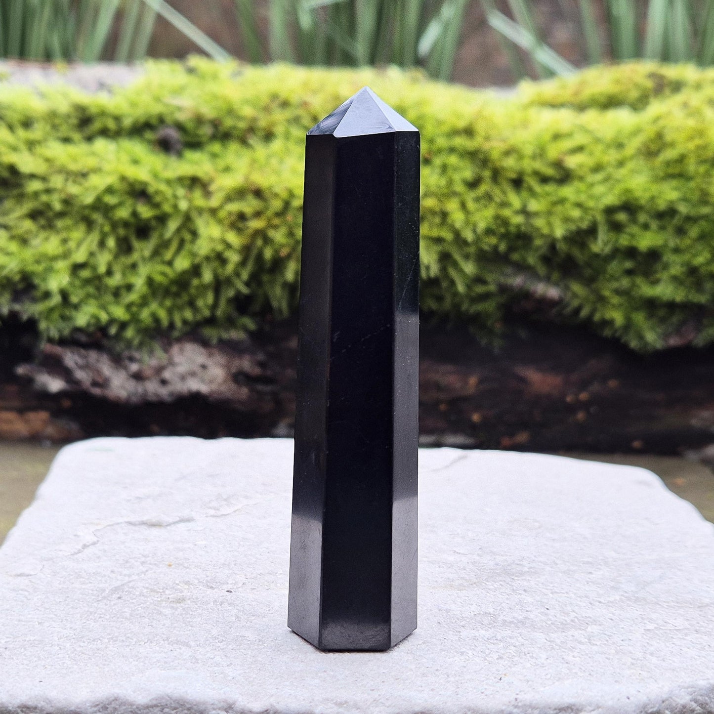 Shungite Point or Tower from the Karelia region of Russia, polished to a smooth finish. Has a 6 sided generator tip.