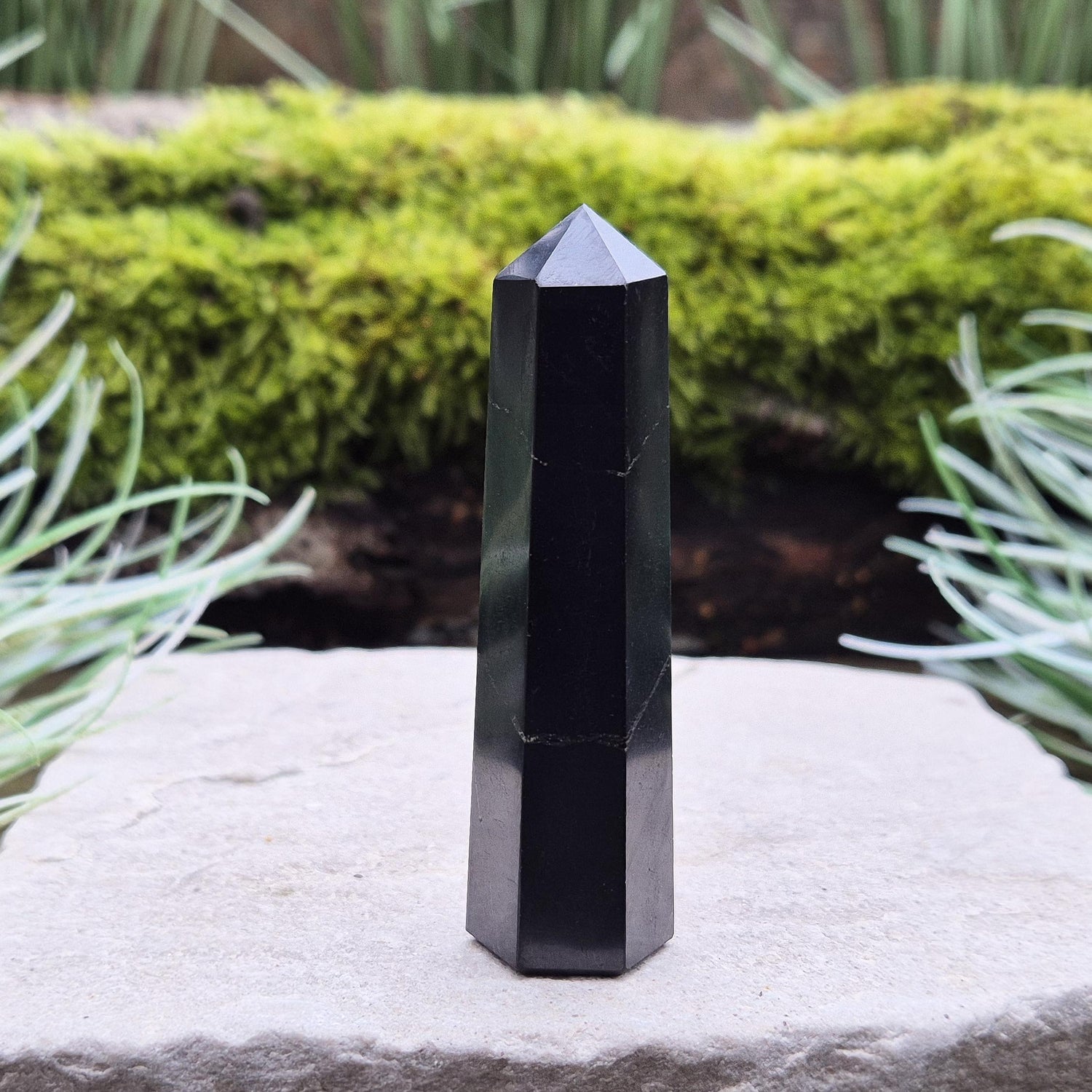 Shungite Point or Tower from the Karelia region of Russia, polished to a smooth finish. Has a 6 sided generator tip.