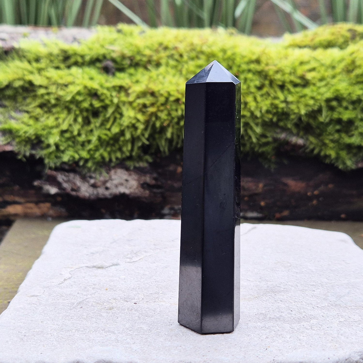 Shungite Point or Tower from the Karelia region of Russia, polished to a smooth finish. Has a 6 sided generator tip.