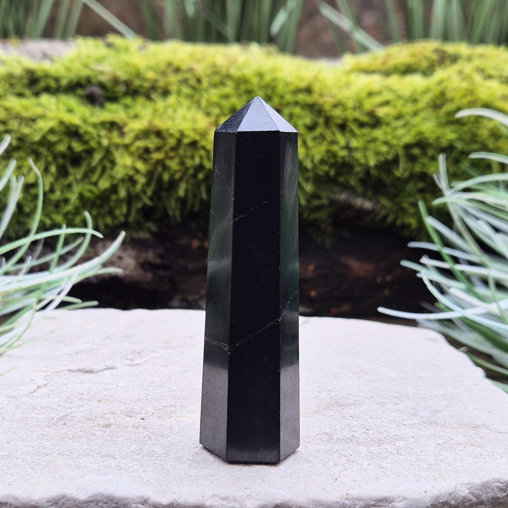 Discover the power of Shungite! This polished point helps create a peaceful environment, perfect for crystal lovers seeking balance and energy protection.