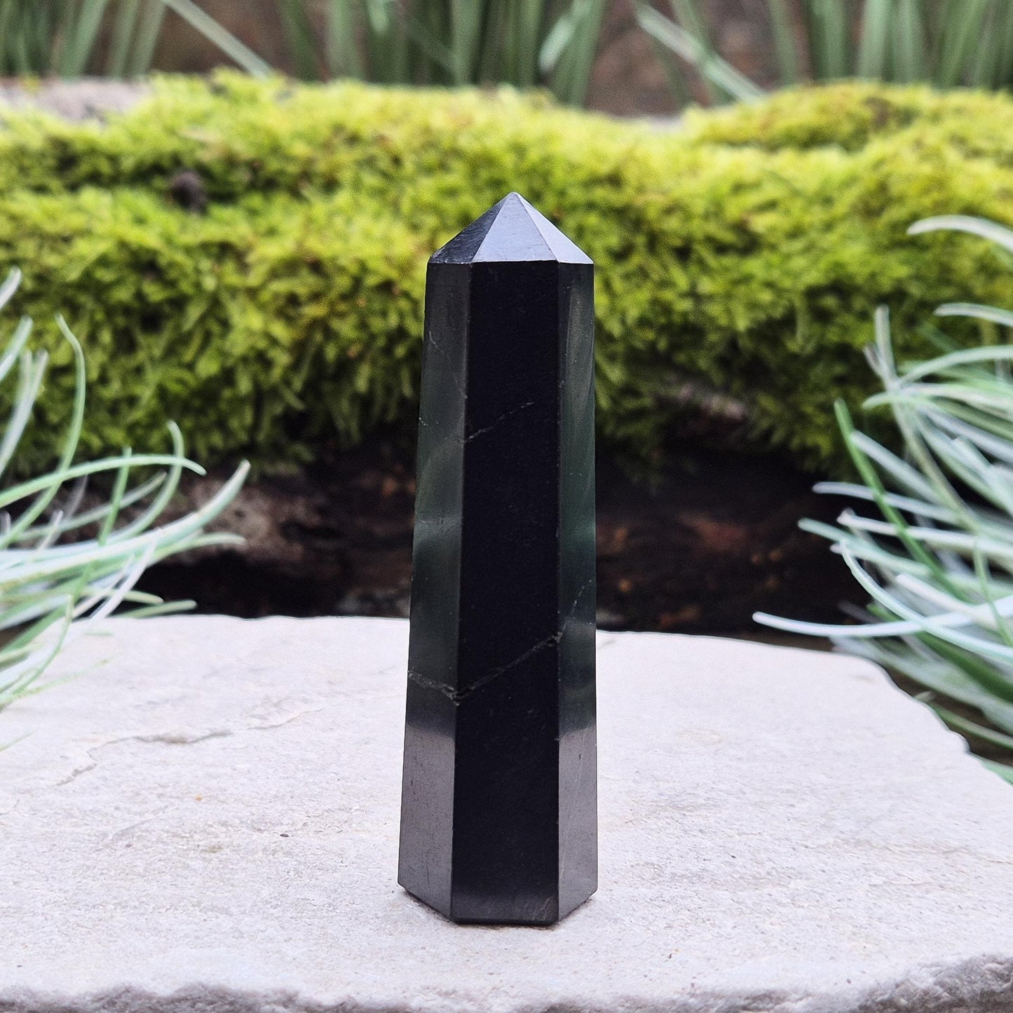 Shungite Point or Tower from the Karelia region of Russia, polished to a smooth finish. Has a 6 sided generator tip.