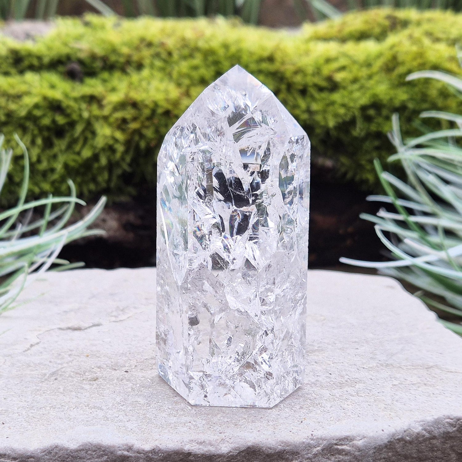 Fire and Ice Quartz Polished Standing Point (also known as Rainbow Quartz) is created by heating and rapidly cooling quartz. 