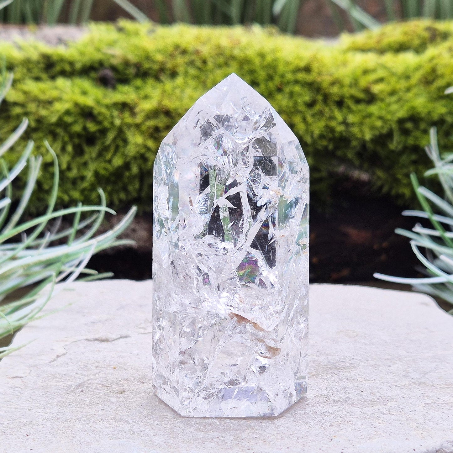 Fire and Ice Quartz Polished Standing Point (also known as Rainbow Quartz) is created by heating and rapidly cooling quartz. 