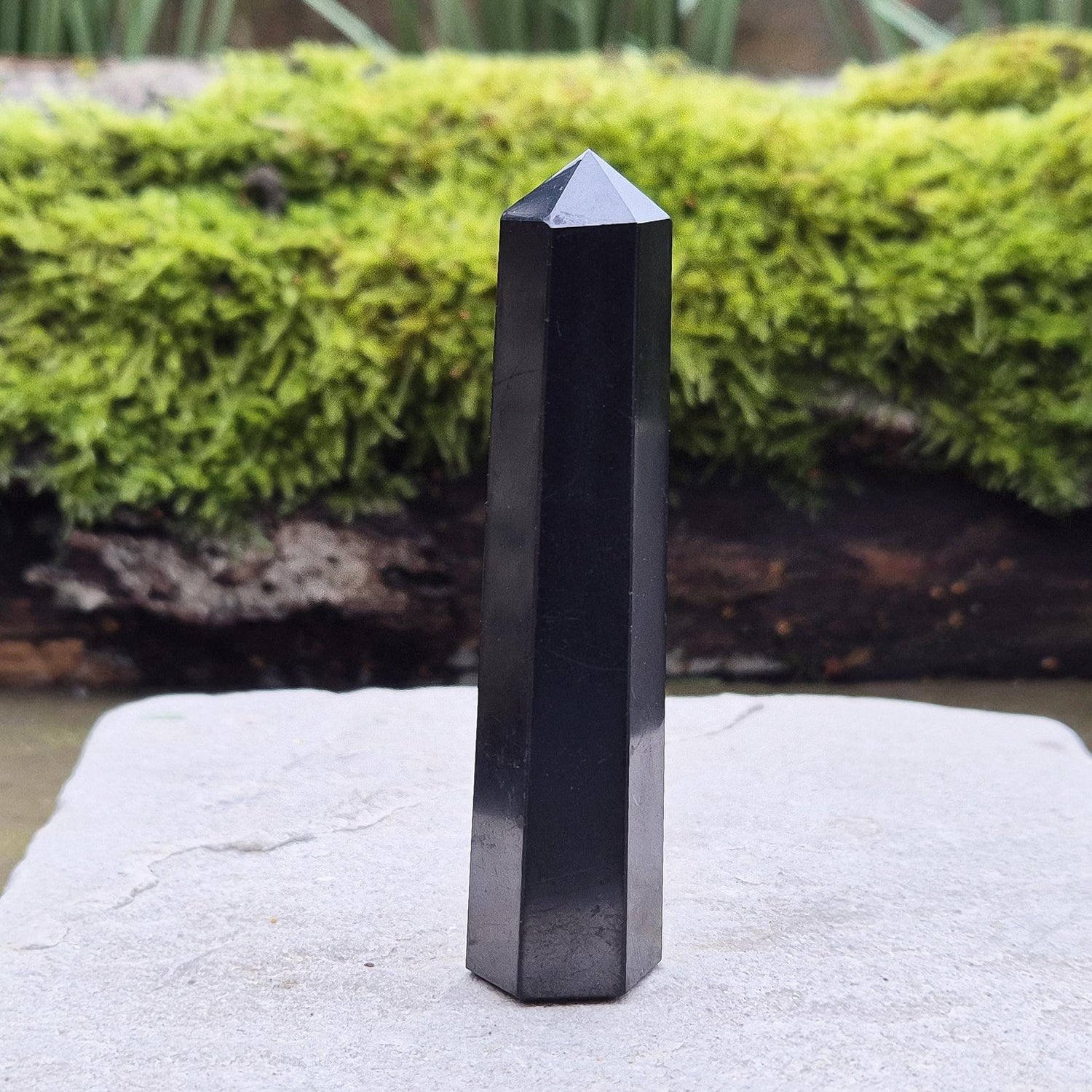 Shungite Point or Tower from the Karelia region of Russia, polished to a smooth finish. Has a 6 sided generator tip.