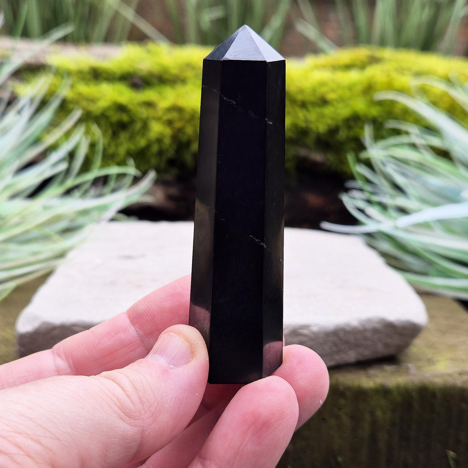 Shungite Point or Tower from the Karelia region of Russia, polished to a smooth finish. Has a 6 sided generator tip.