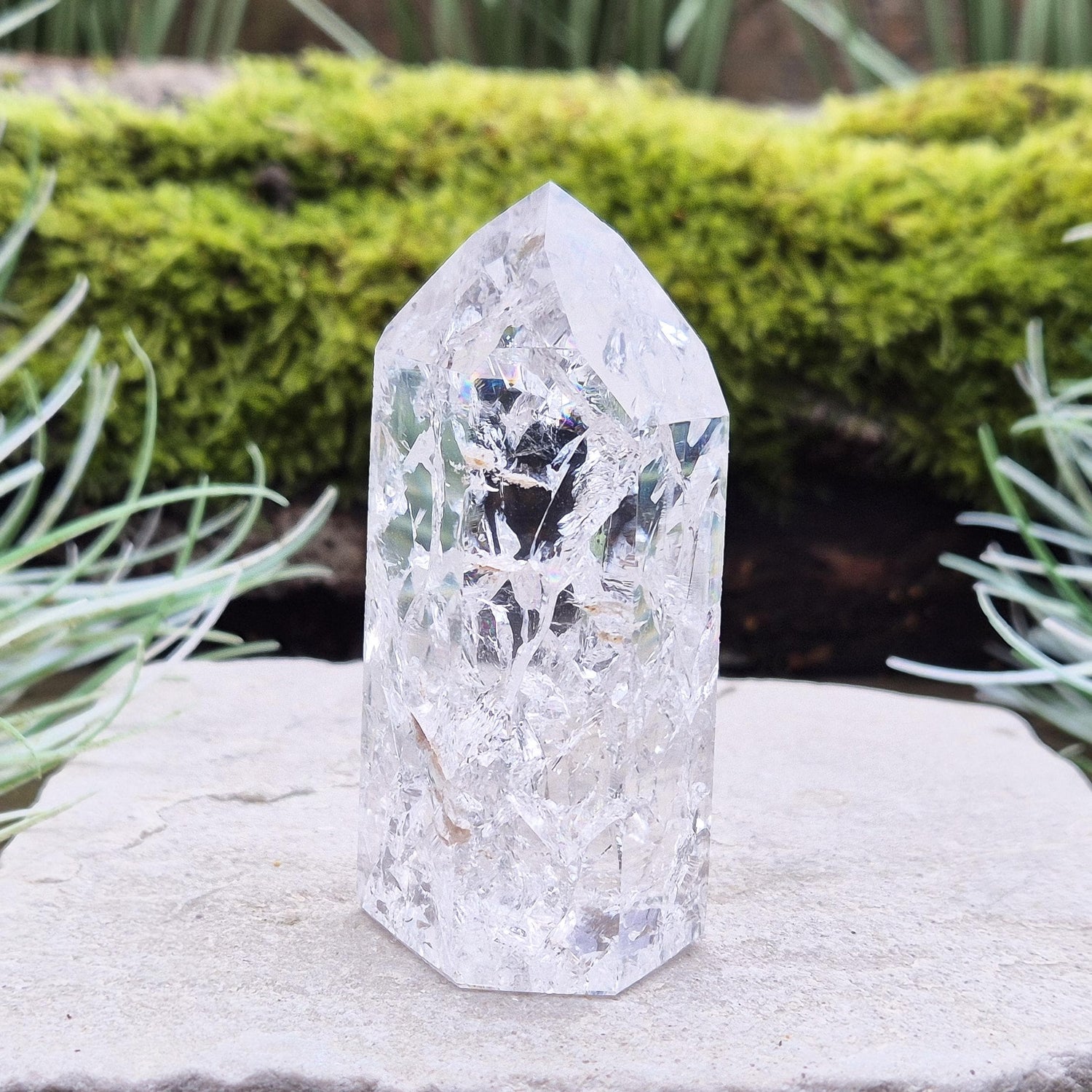 Fire and Ice Quartz Polished Standing Point (also known as Rainbow Quartz) is created by heating and rapidly cooling quartz. 