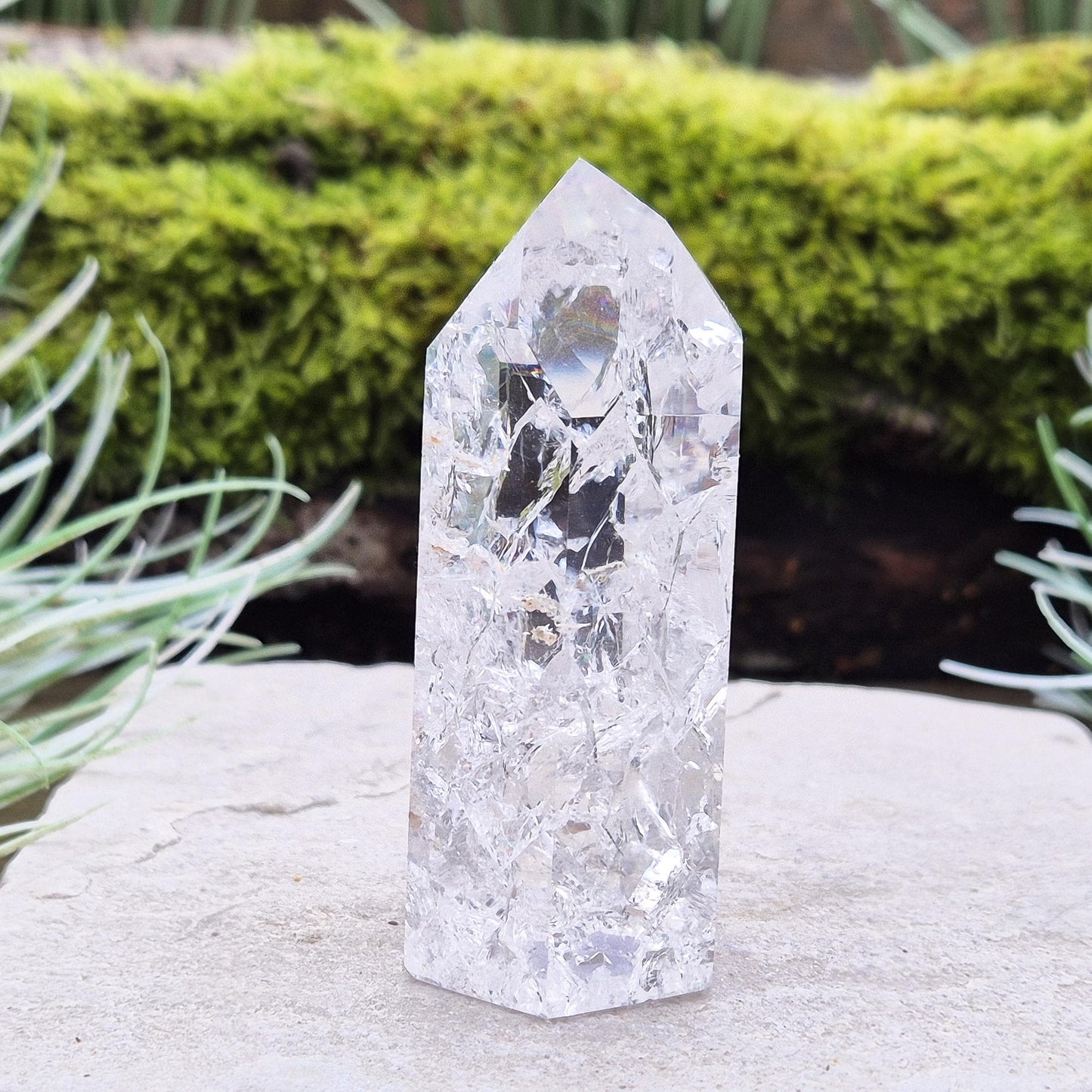 Fire and Ice Quartz Polished Standing Point (also known as Rainbow Quartz) is created by heating and rapidly cooling quartz. 