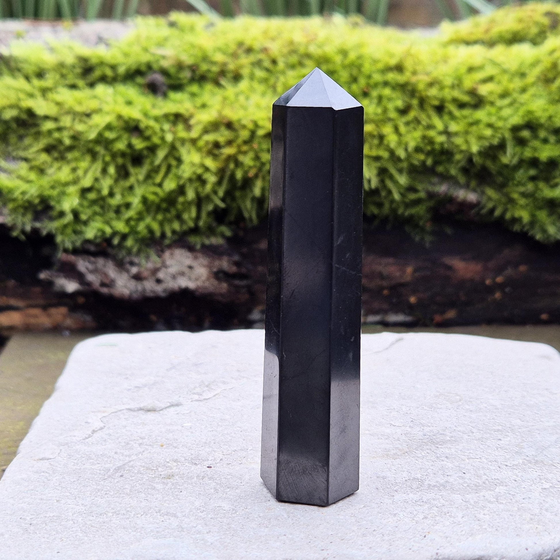 Discover the power of Shungite! This polished point helps create a peaceful environment, perfect for crystal lovers seeking balance and energy protection.