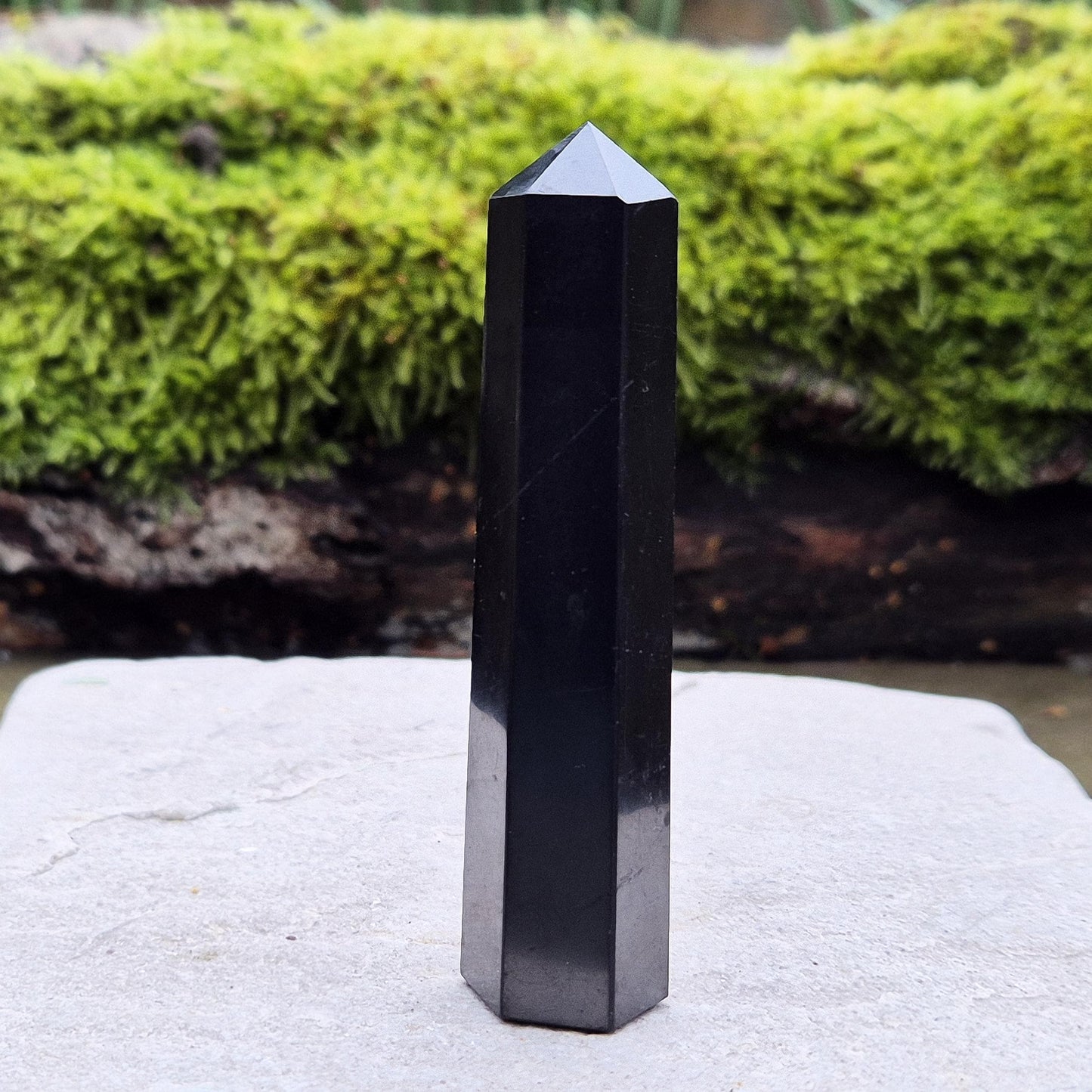 Discover the power of Shungite! This polished point helps create a peaceful environment, perfect for crystal lovers seeking balance and energy protection.