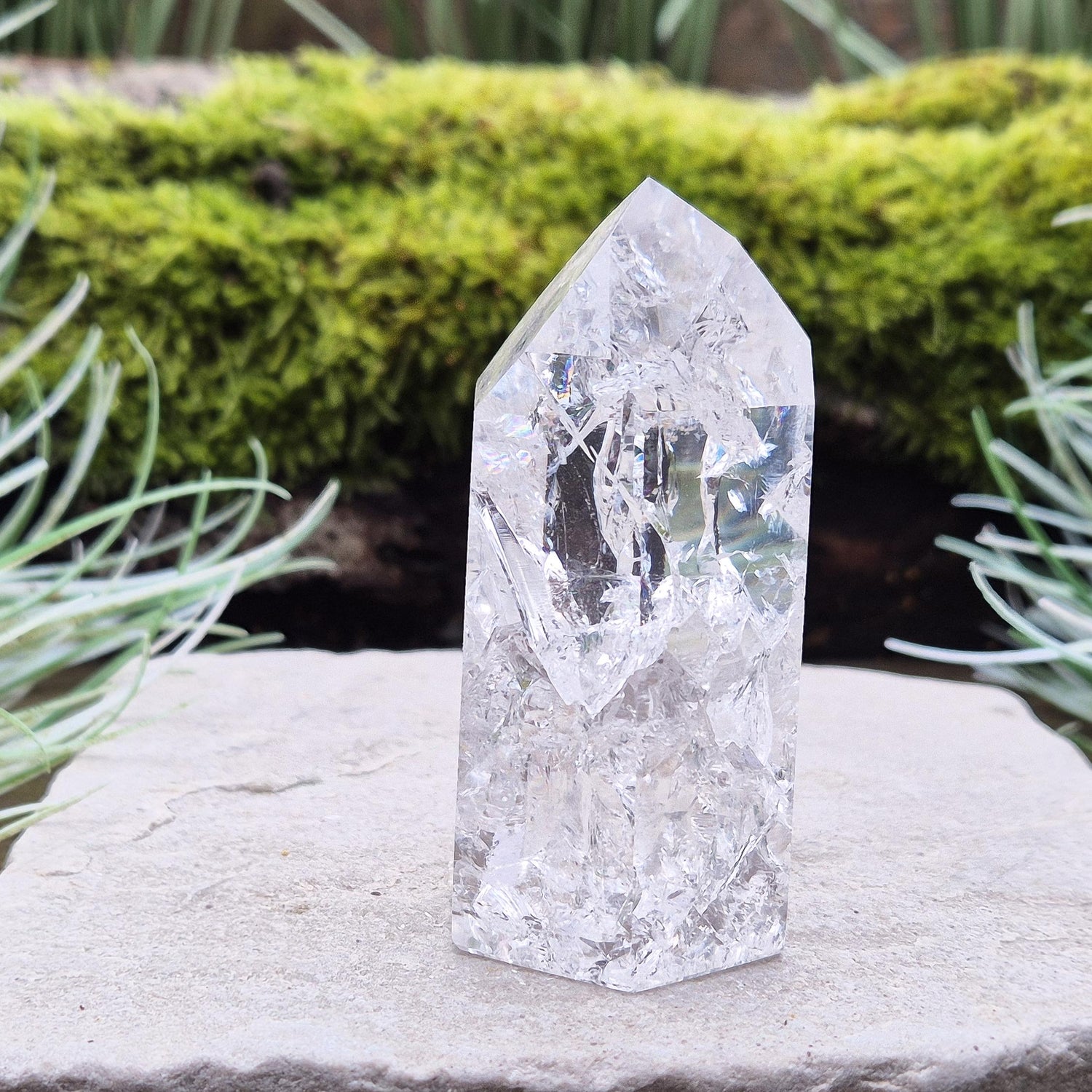 Fire and Ice Quartz Polished Standing Point (also known as Rainbow Quartz) is created by heating and rapidly cooling quartz. 