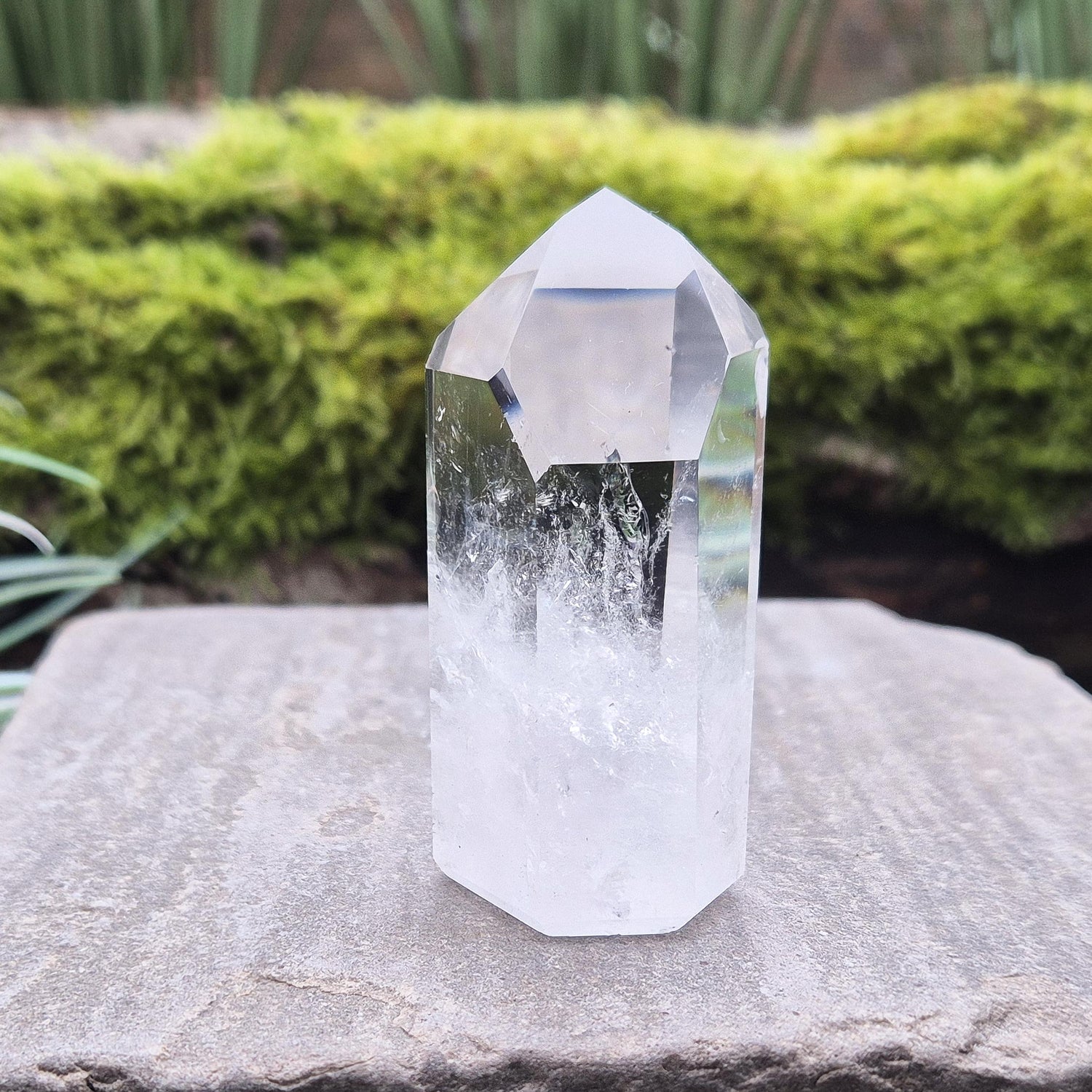 Quartz Crystal Point with 2 non symmetrical isis faces from Brazil. This is a wonderfully point with lovely clarity middle to tip and wispy clouds towards the base. A grade.