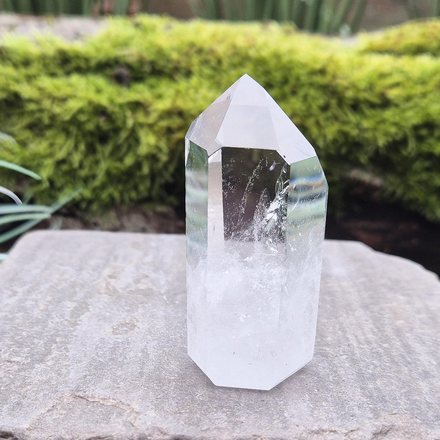 Quartz Crystal Point with 2 non symmetrical isis faces from Brazil. This is a wonderfully point with lovely clarity middle to tip and wispy clouds towards the base. A grade.