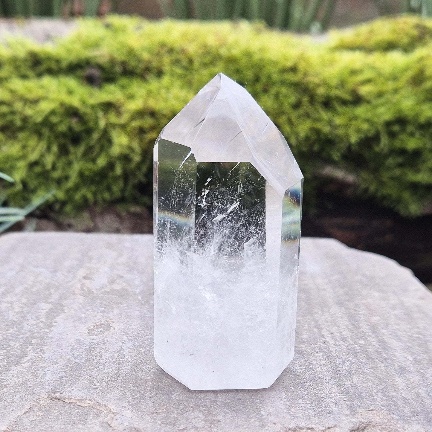 Quartz Crystal Point with 2 non symmetrical isis faces from Brazil. This is a wonderfully point with lovely clarity middle to tip and wispy clouds towards the base. A grade.