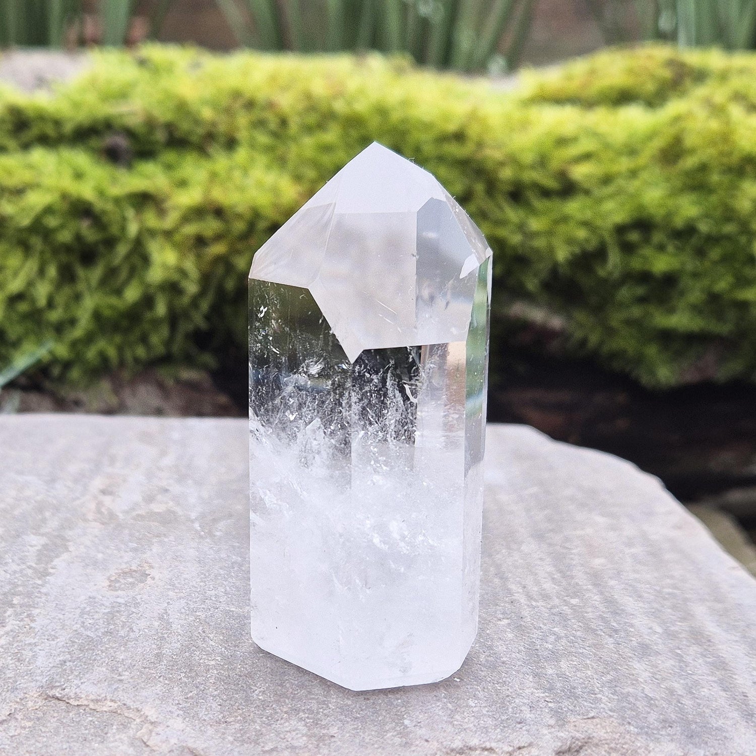 Quartz Crystal Point with 2 non symmetrical isis faces from Brazil. This is a wonderfully point with lovely clarity middle to tip and wispy clouds towards the base. A grade.