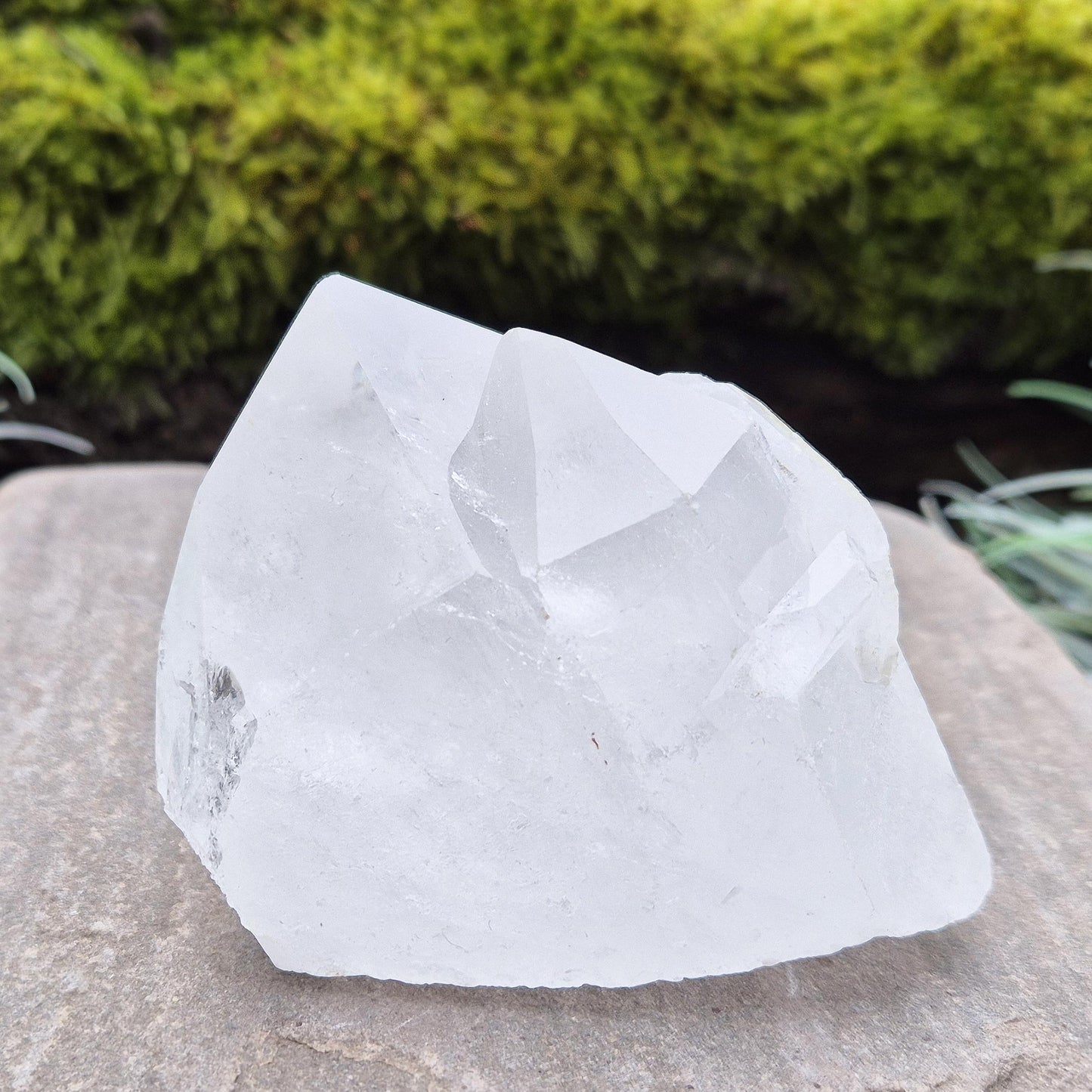 Quartz Crystal Cluster. From Brazil. This cluster comprises of one larger point, a smaller point, and then a companion crystal embedded into the smaller of the 2 points. Will self stand. Base a lovely shine/shimmer to it.