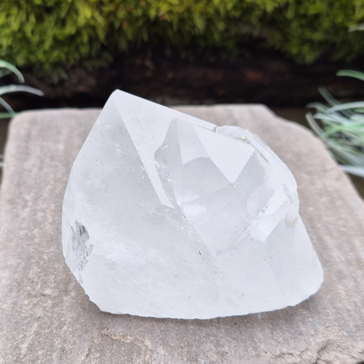 Quartz Crystal Cluster. From Brazil. This cluster comprises of one larger point, a smaller point, and then a companion crystal embedded into the smaller of the 2 points. Will self stand. Base a lovely shine/shimmer to it.