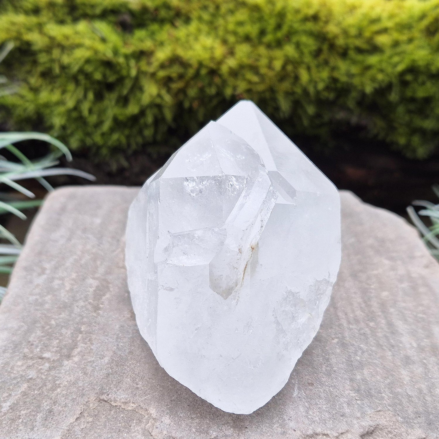 Quartz Crystal Cluster. From Brazil. This cluster comprises of one larger point, a smaller point, and then a companion crystal embedded into the smaller of the 2 points. Will self stand. Base a lovely shine/shimmer to it.