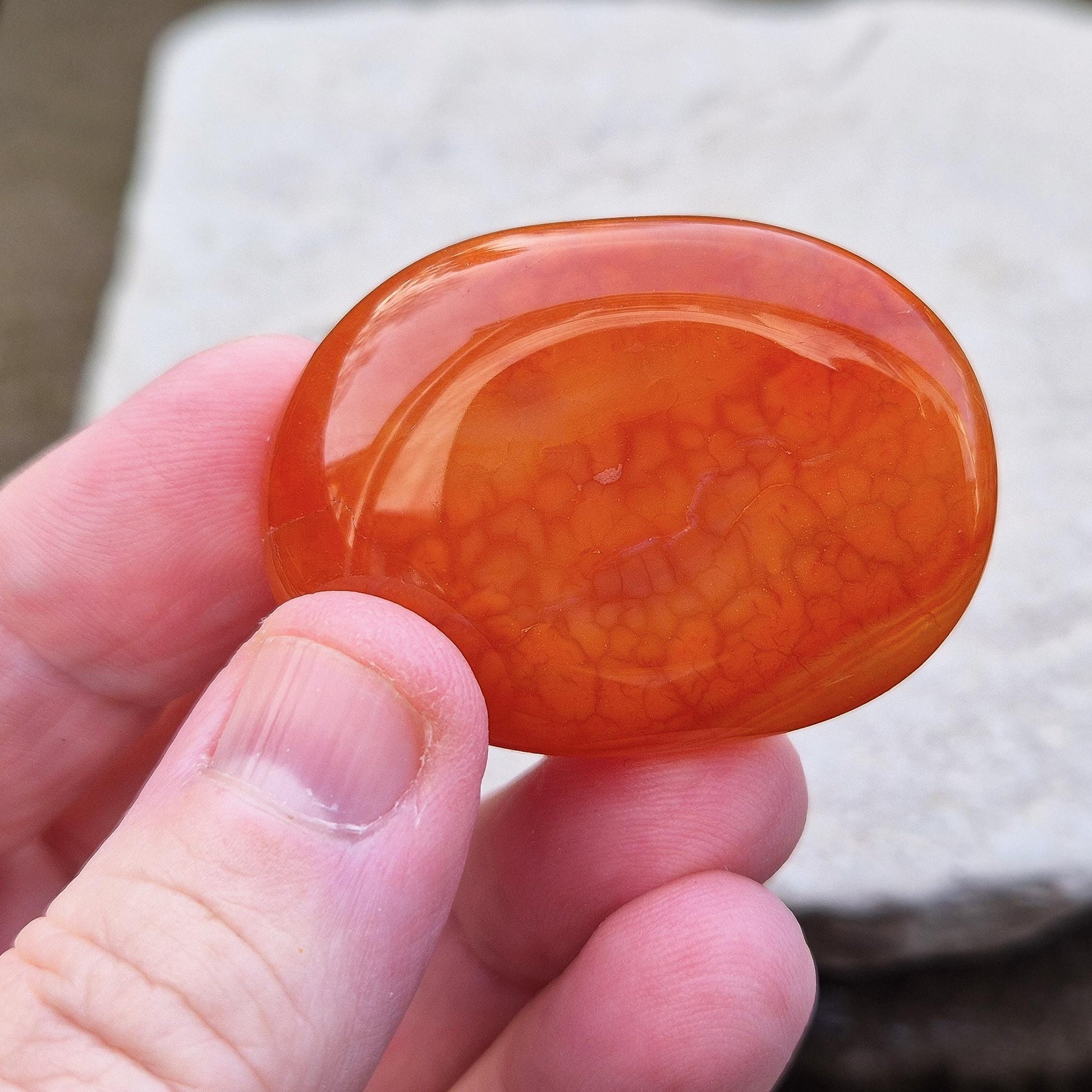 Crackle Agate Palm Stone. Crackle Agate is a stunning variety of chalcedony, a microcrystalline form of quartz, that undergoes a special heat treatment to create intricate internal fractures.