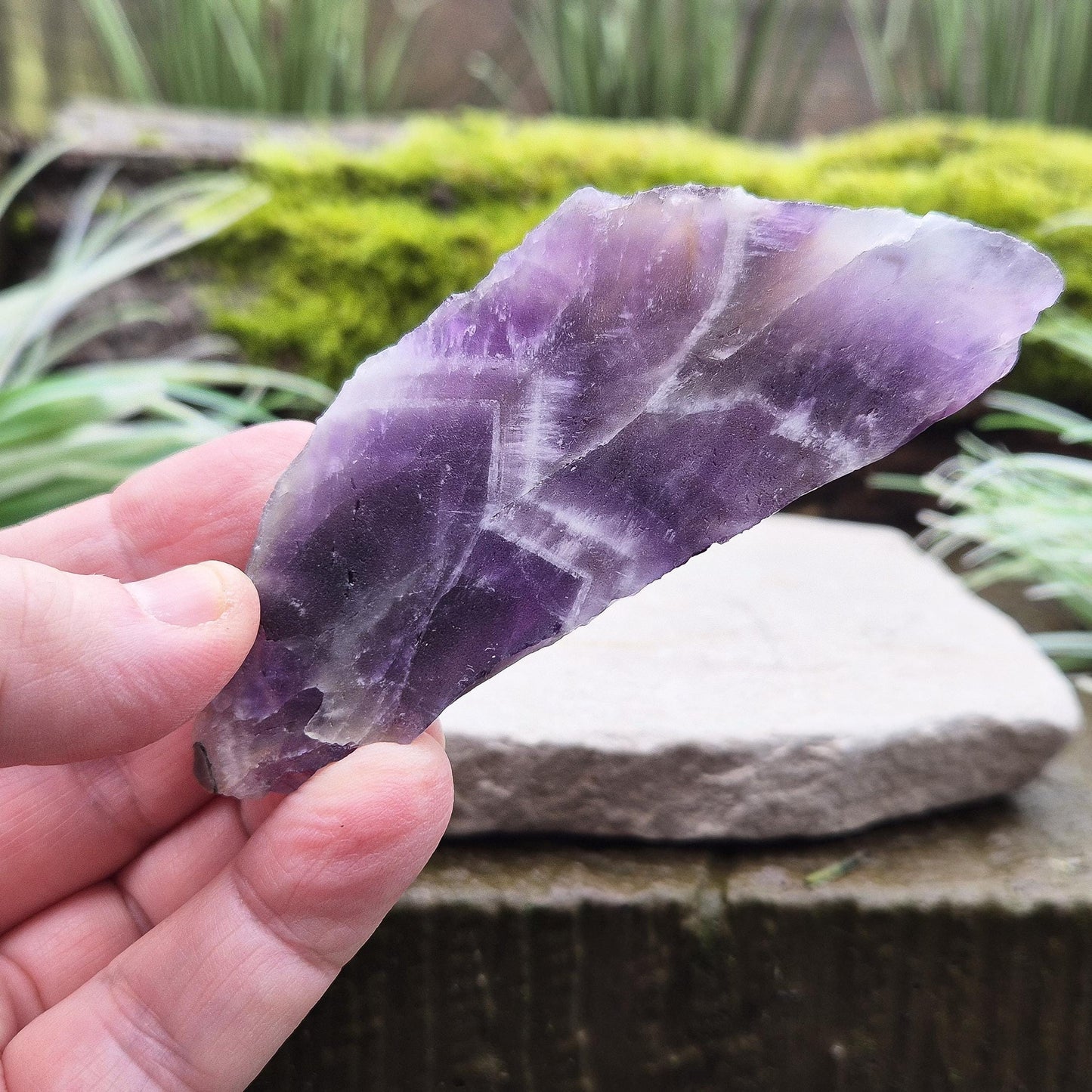 Chevron Amethyst Crystal Platform. One side is left untouched in its raw form, while the other is cut flat to create a versatile platform for displaying crystals, pendulums or jewellery or for practical use. 