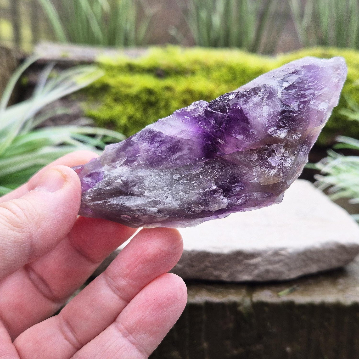 Chevron Amethyst Crystal Platform. One side is left untouched in its raw form, while the other is cut flat to create a versatile platform for displaying crystals, pendulums or jewellery or for practical use. 