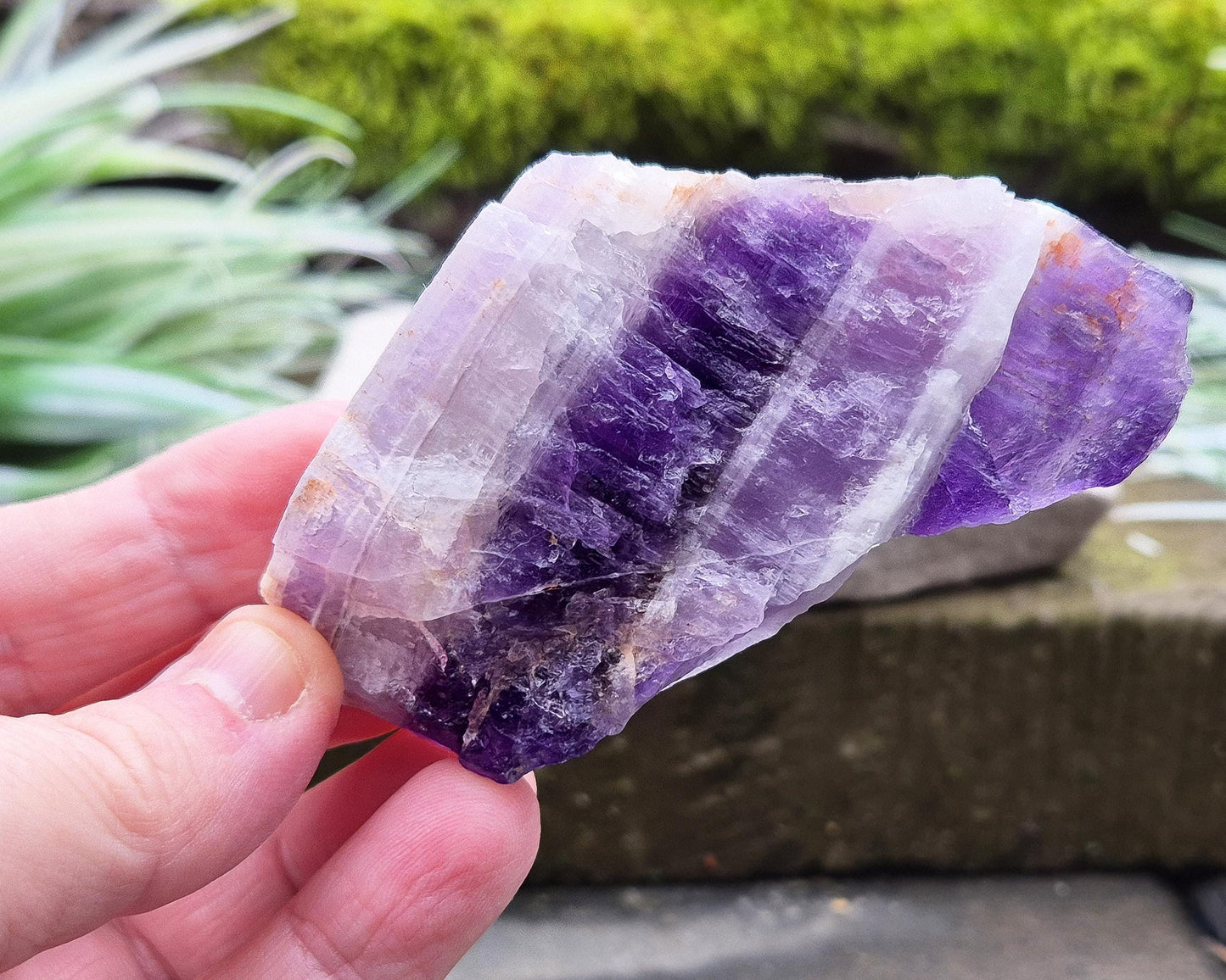 Chevron Amethyst Crystal Platform. One side is left untouched in its raw form, while the other is cut flat to create a versatile platform for displaying crystals, pendulums or jewellery or for practical use. 