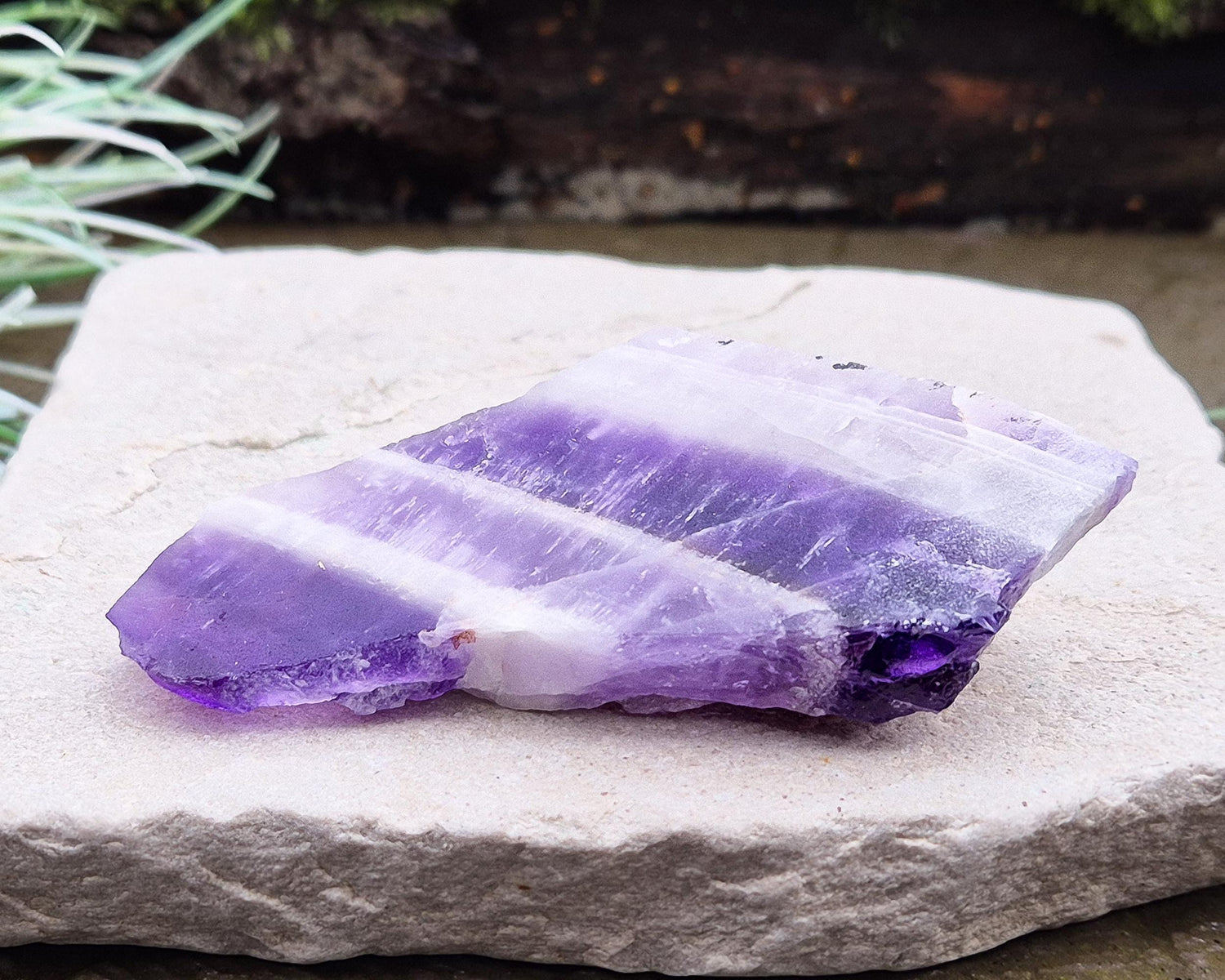 Chevron Amethyst Crystal Platform. One side is left untouched in its raw form, while the other is cut flat to create a versatile platform for displaying crystals, pendulums or jewellery or for practical use. 