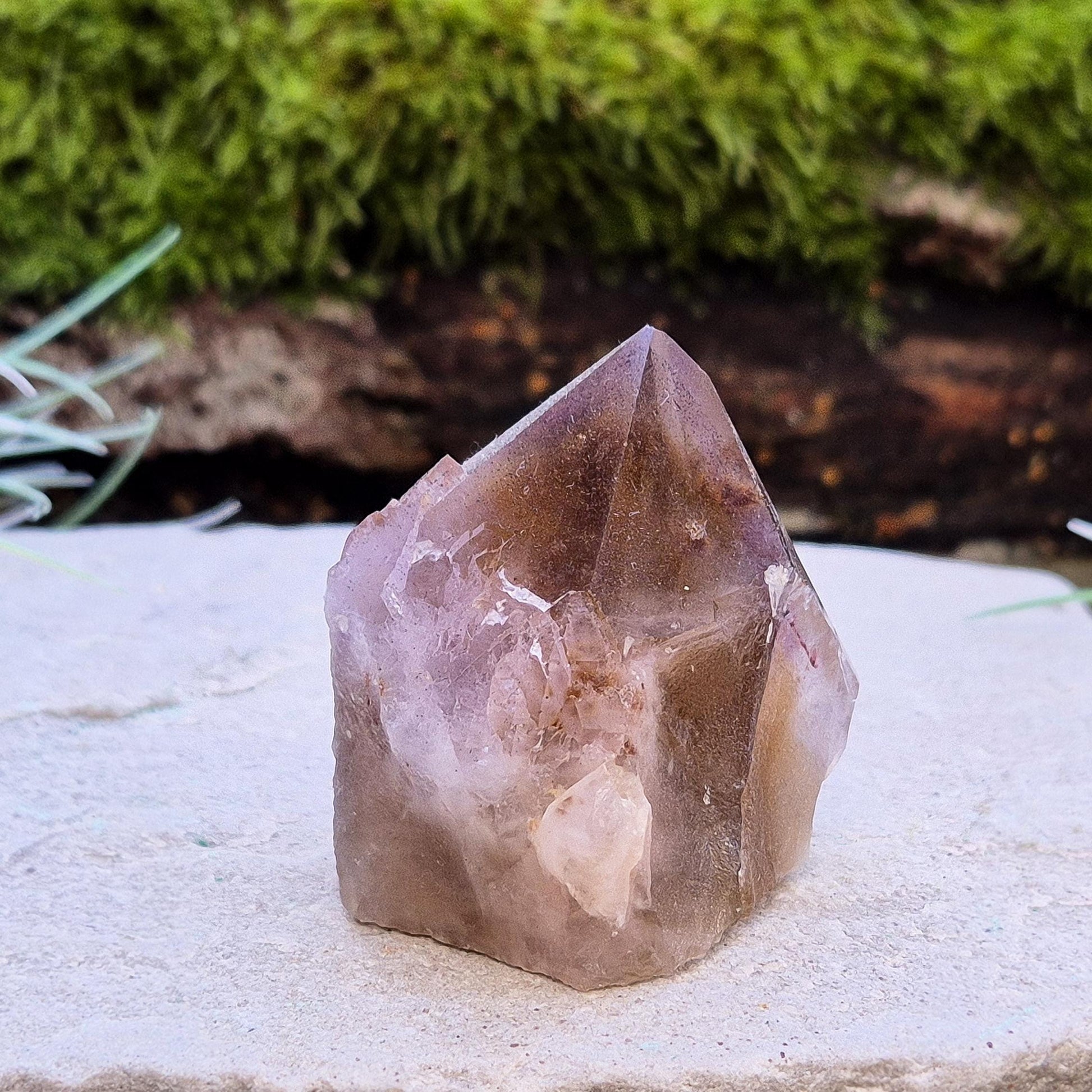 Ametrine Crystal standing point, from the Sichuan Province, China. Color really shows through in the natural light. Polished tip, natural body, cut base.