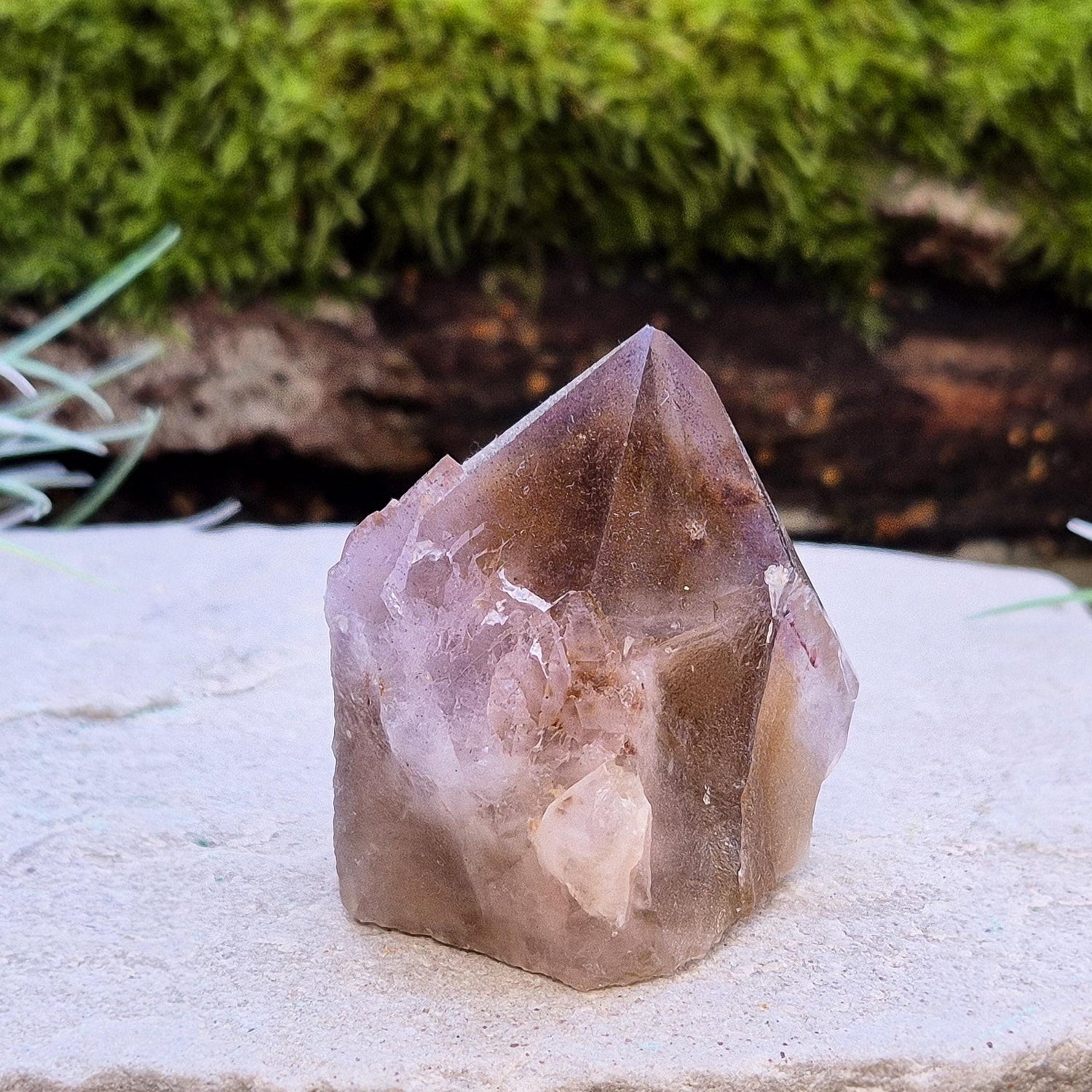 Ametrine Crystal standing point, from the Sichuan Province, China. Color really shows through in the natural light. Polished tip, natural body, cut base.