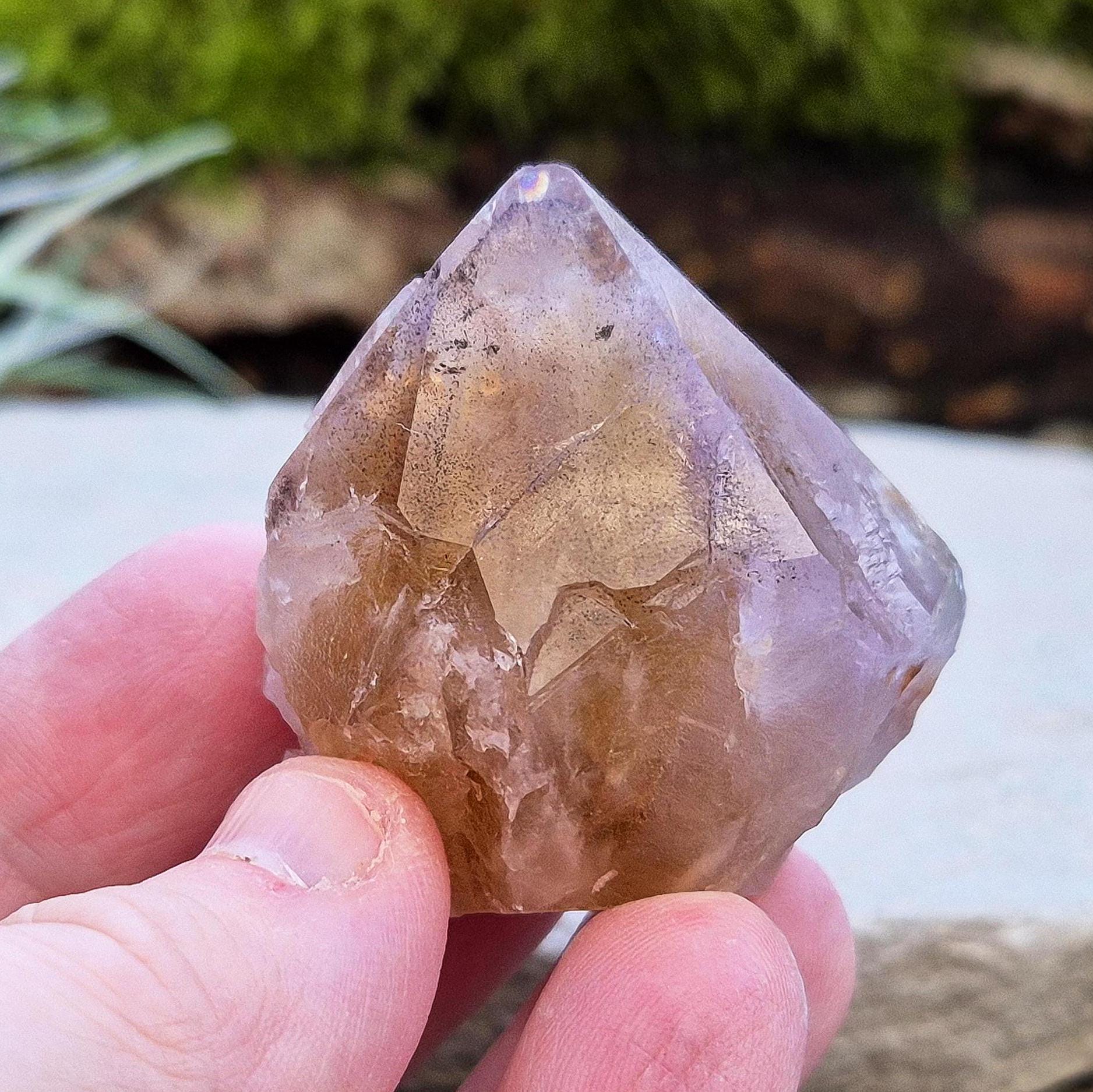Ametrine Crystal standing point, from the Sichuan Province, China. Color really shows through in the natural light. Polished tip, natural body, cut base.