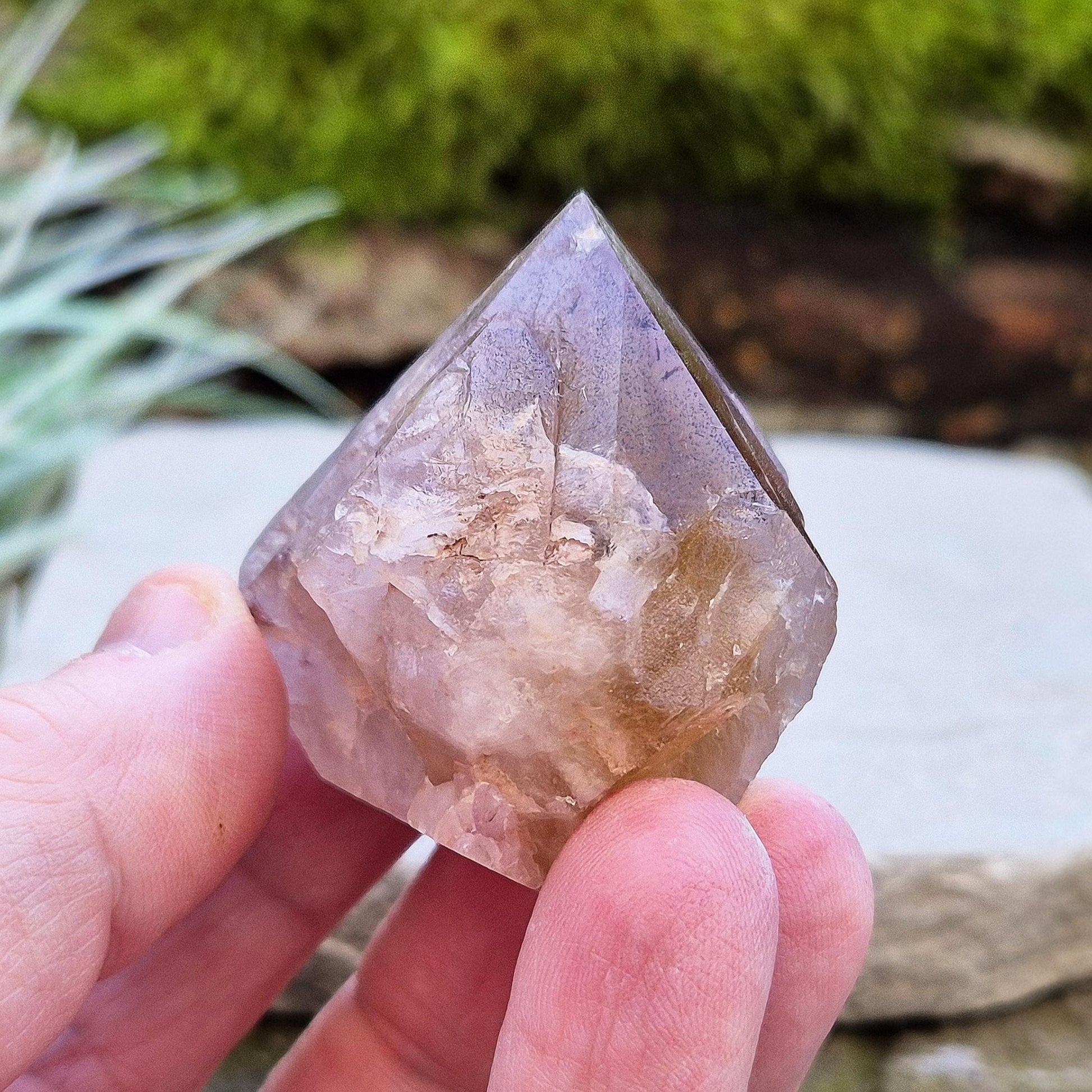 Ametrine Crystal standing point, from the Sichuan Province, China. Color really shows through in the natural light. Polished tip, natural body, cut base.