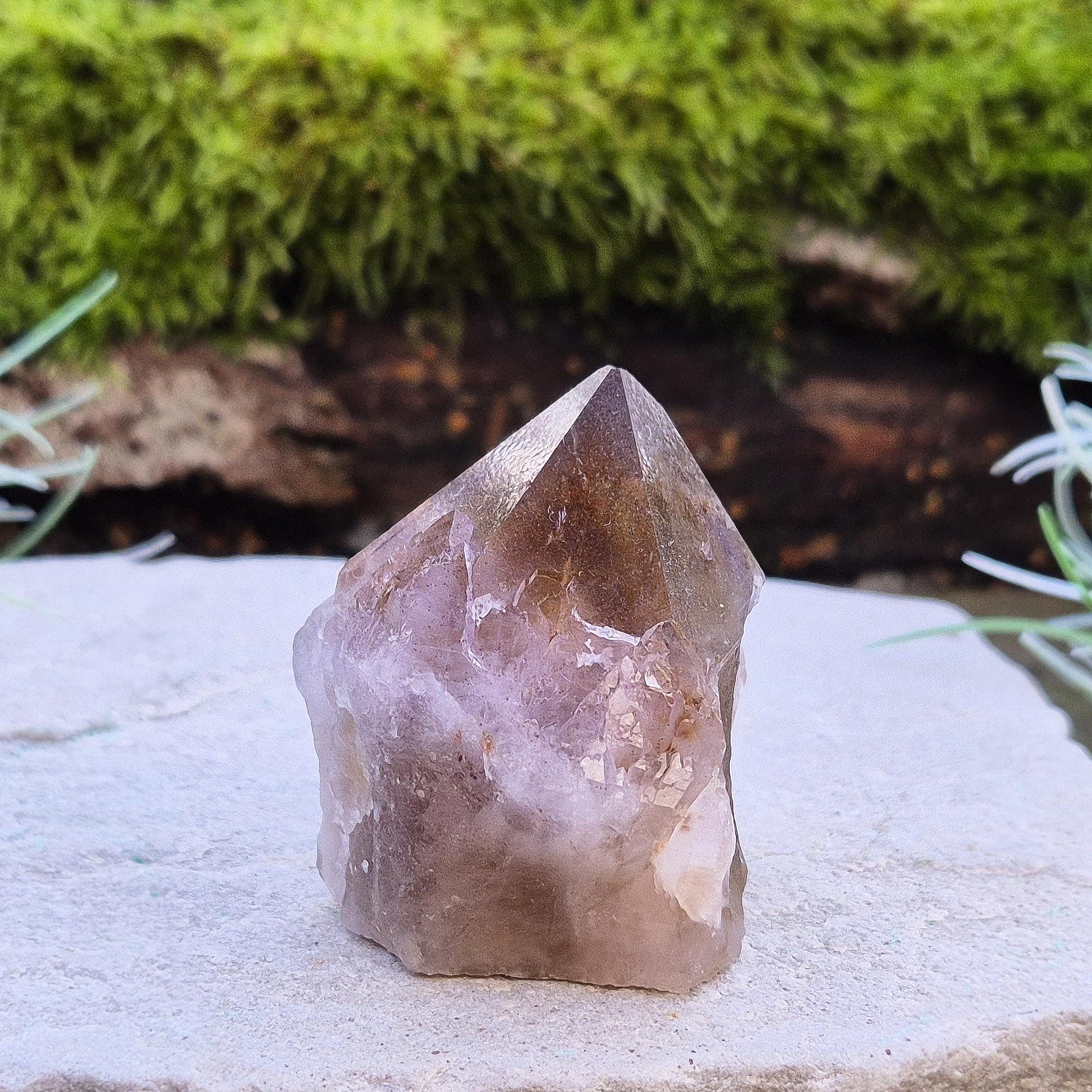 Ametrine Crystal standing point, from the Sichuan Province, China. Color really shows through in the natural light. Polished tip, natural body, cut base.