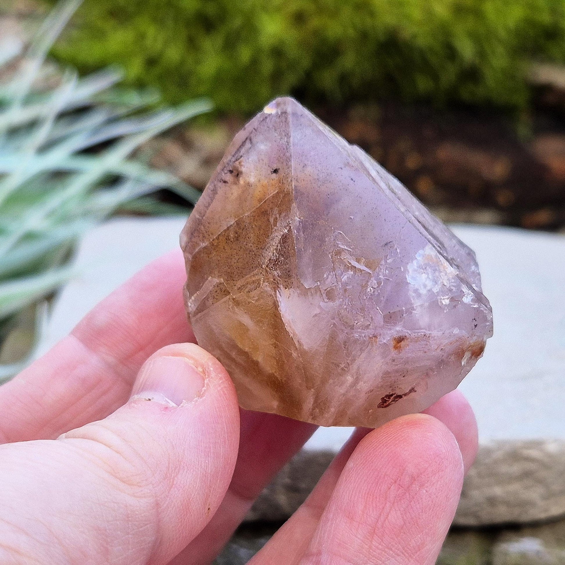 Ametrine Crystal standing point, from the Sichuan Province, China. Color really shows through in the natural light. Polished tip, natural body, cut base.