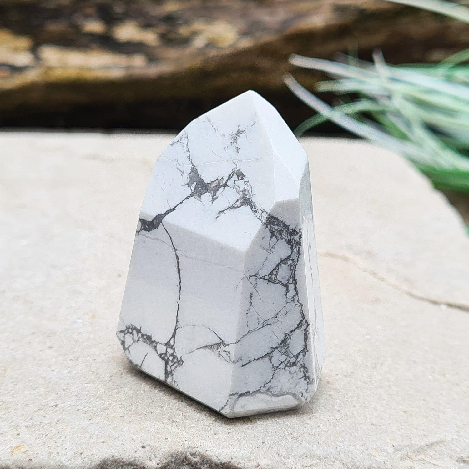 Howlite Crystal Point. Off white with grey marble like patterning, nicely polished. 