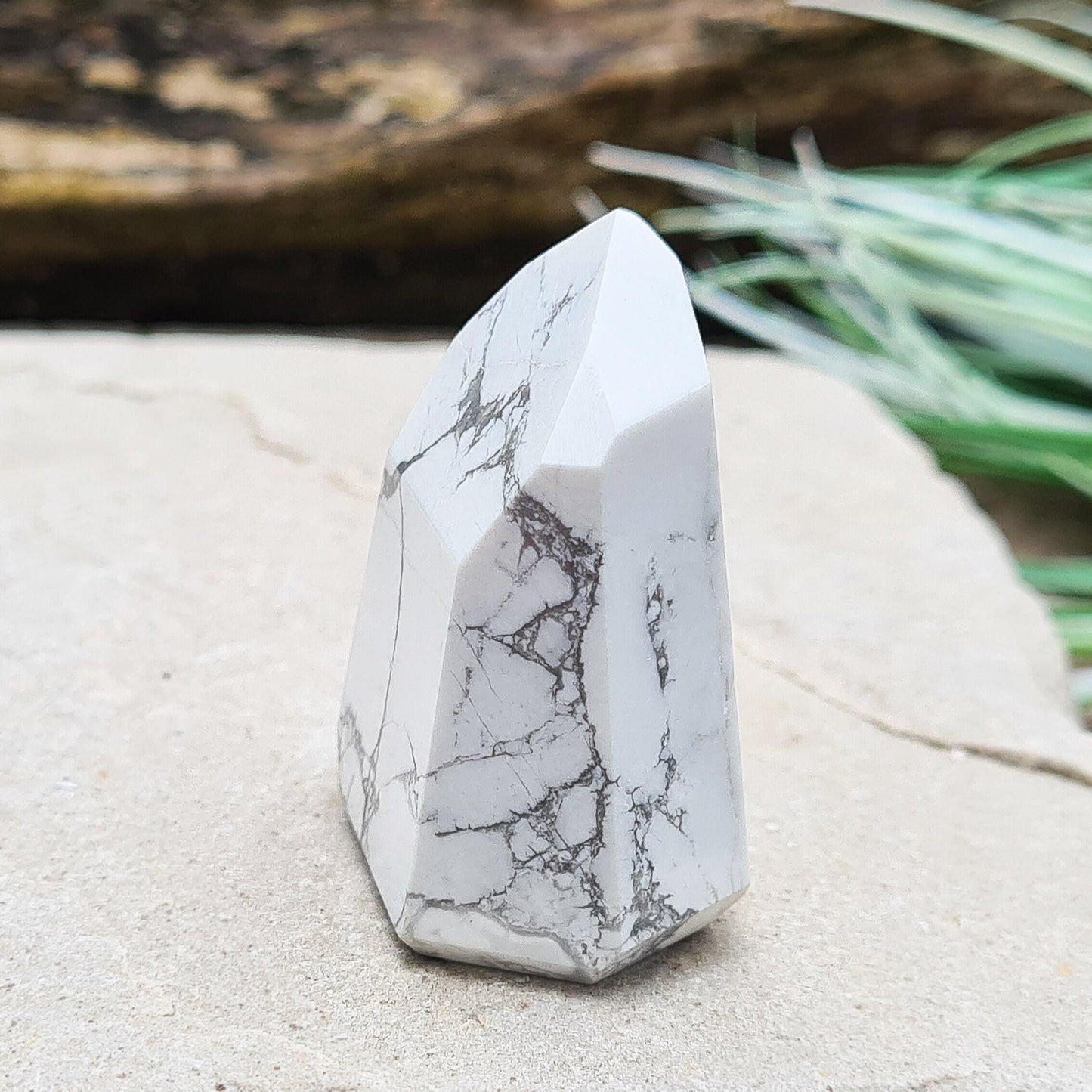 Howlite Crystal Point. Off white with grey marble like patterning, nicely polished. 