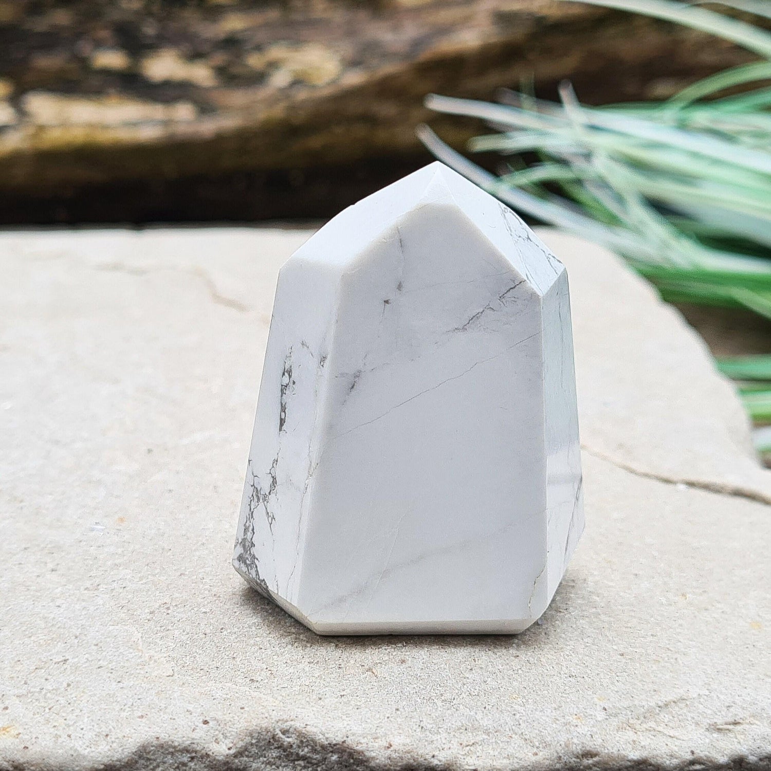 Howlite Crystal Point. Off white with grey marble like patterning, nicely polished. 