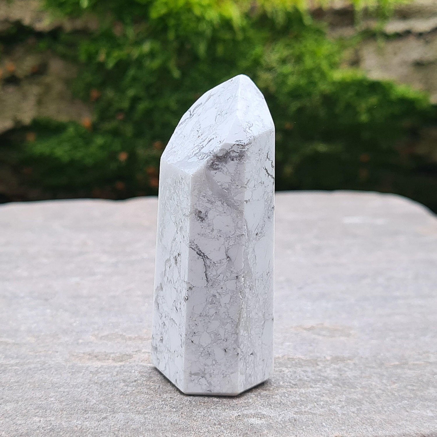 Howlite Crystal Point. Off white with grey marble like patterning, nicely polished. 
