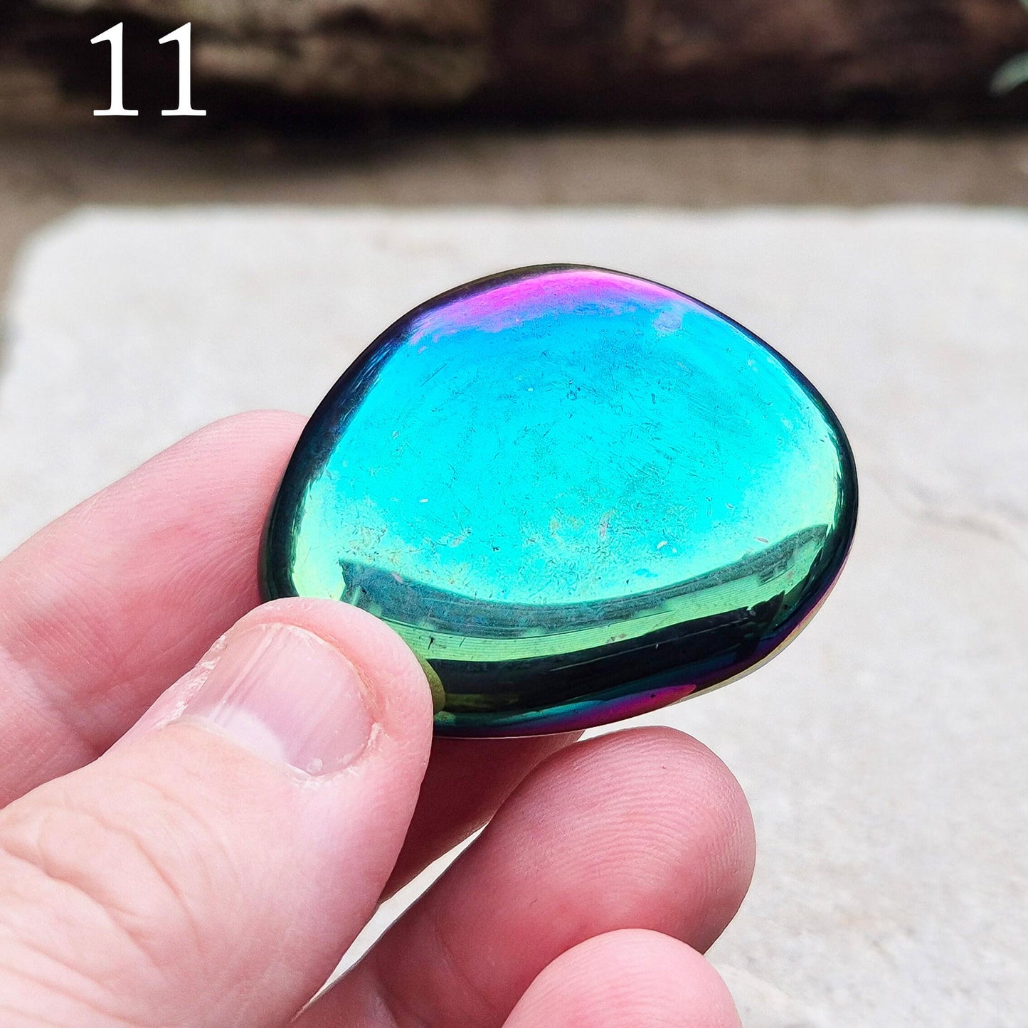 Titanium Aura Obsidian Palm Stone, also known as Rainbow Aura, Mystic Obsidian, Flame Aura, and Dark Rainbow Aura. The Obsidian is from Mexico. 